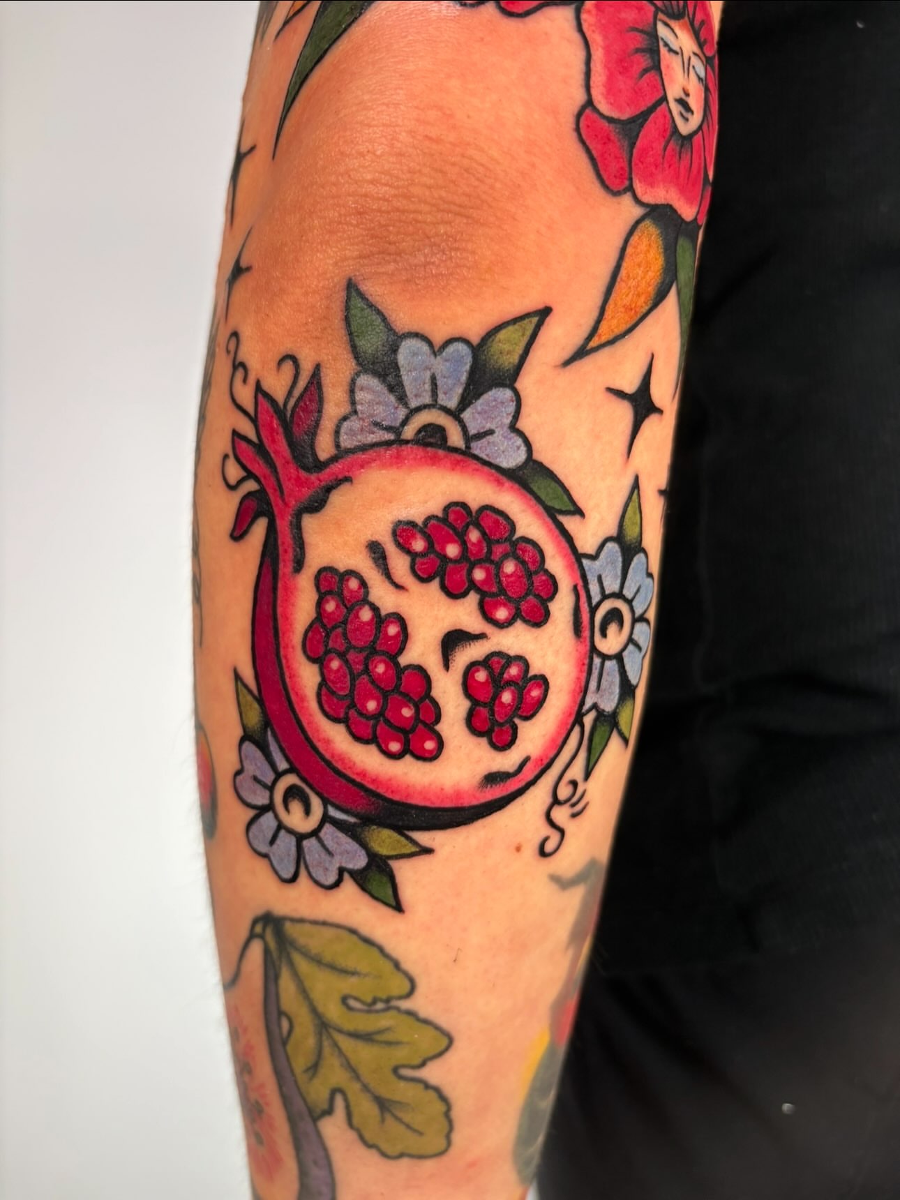 Pomegranate American traditional tattoo on the forearm by Lorelei