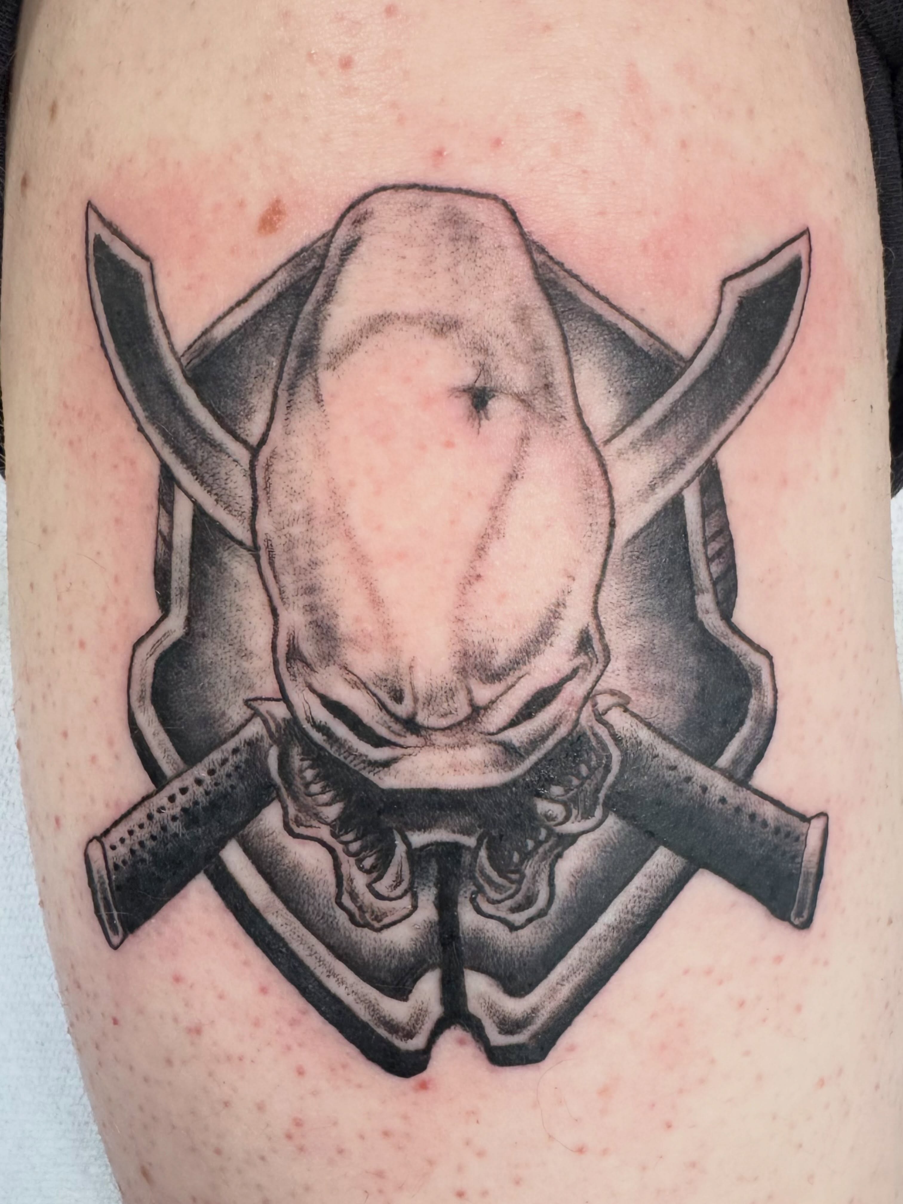 Alien head with swords geometric tattoo on the forearm by Elmer Lethco