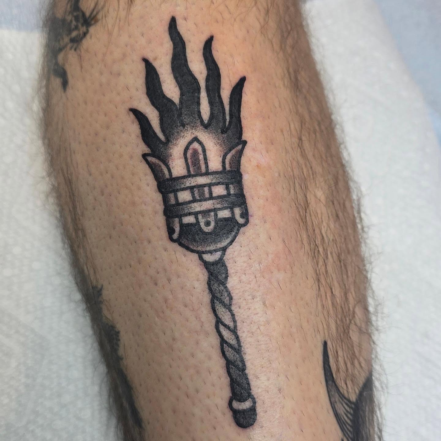 Torch black and grey tattoo on the forearm by A. Teixeira, Los Angeles, California