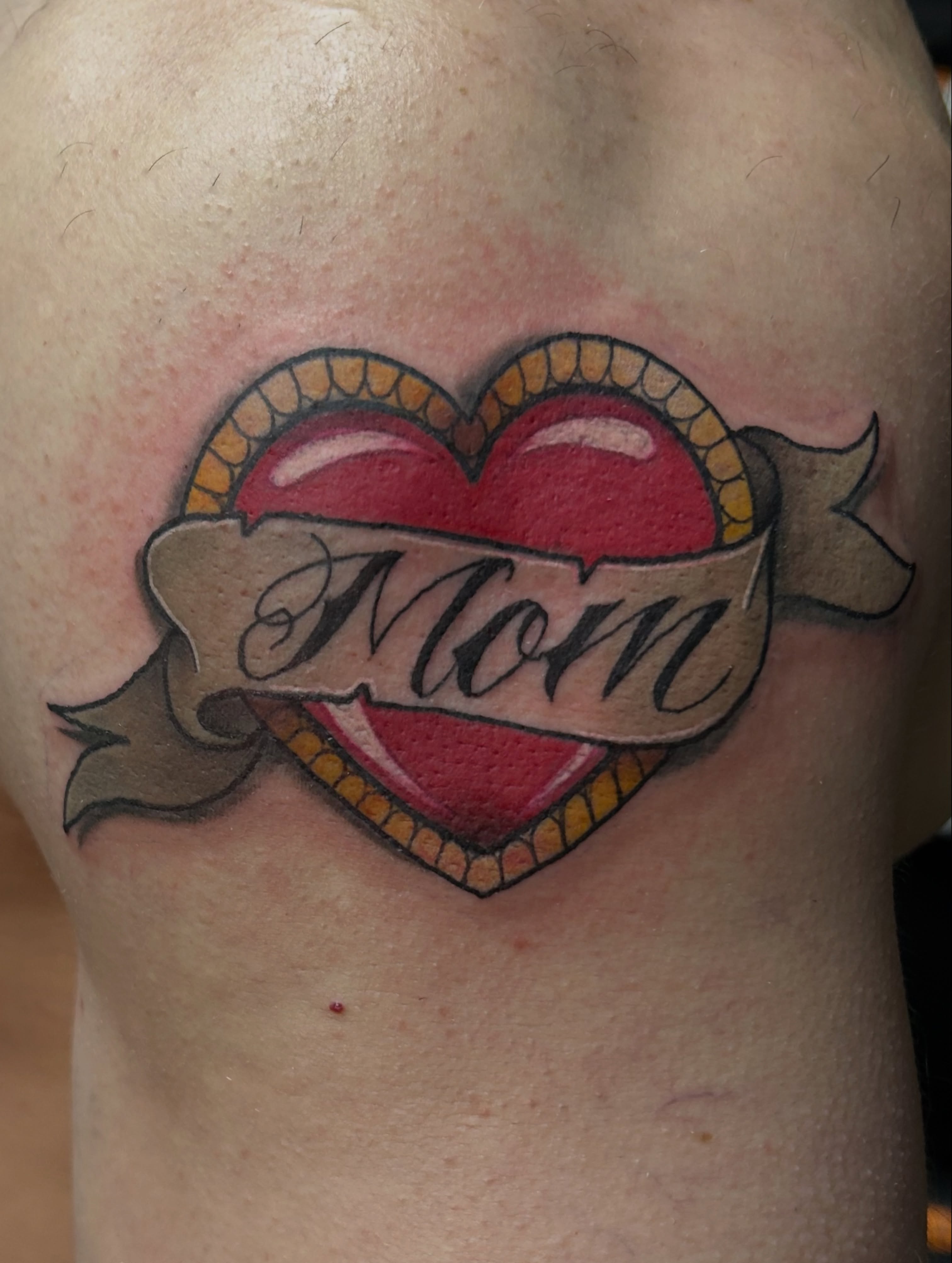 Heart with ribbon American traditional tattoo on the shoulder by ⚡️𝑺𝑻𝑬𝑽𝑬 𝑩𝑼𝒀𝑨𝑪𝑯𝑬𝑲⚡️