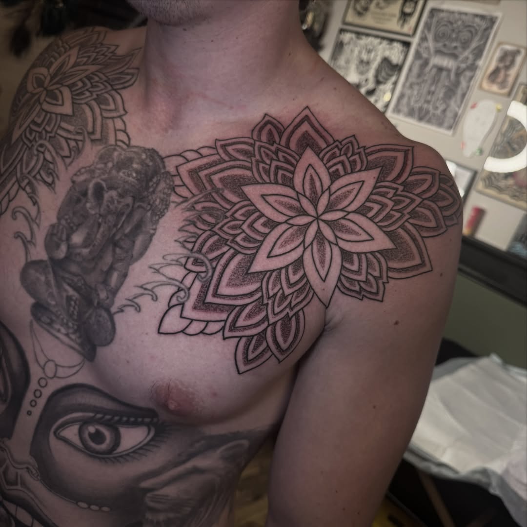 Mandala geometric tattoo on the chest by Mtctattoos
