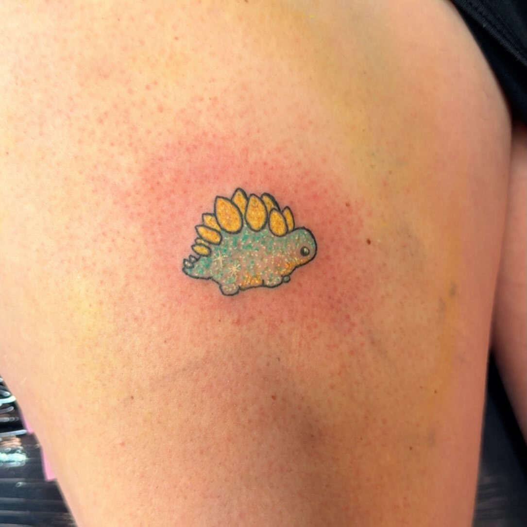 Stegosaurus dotwork tattoo on the shoulder by Felicia Lee, Des Moines, Iowa