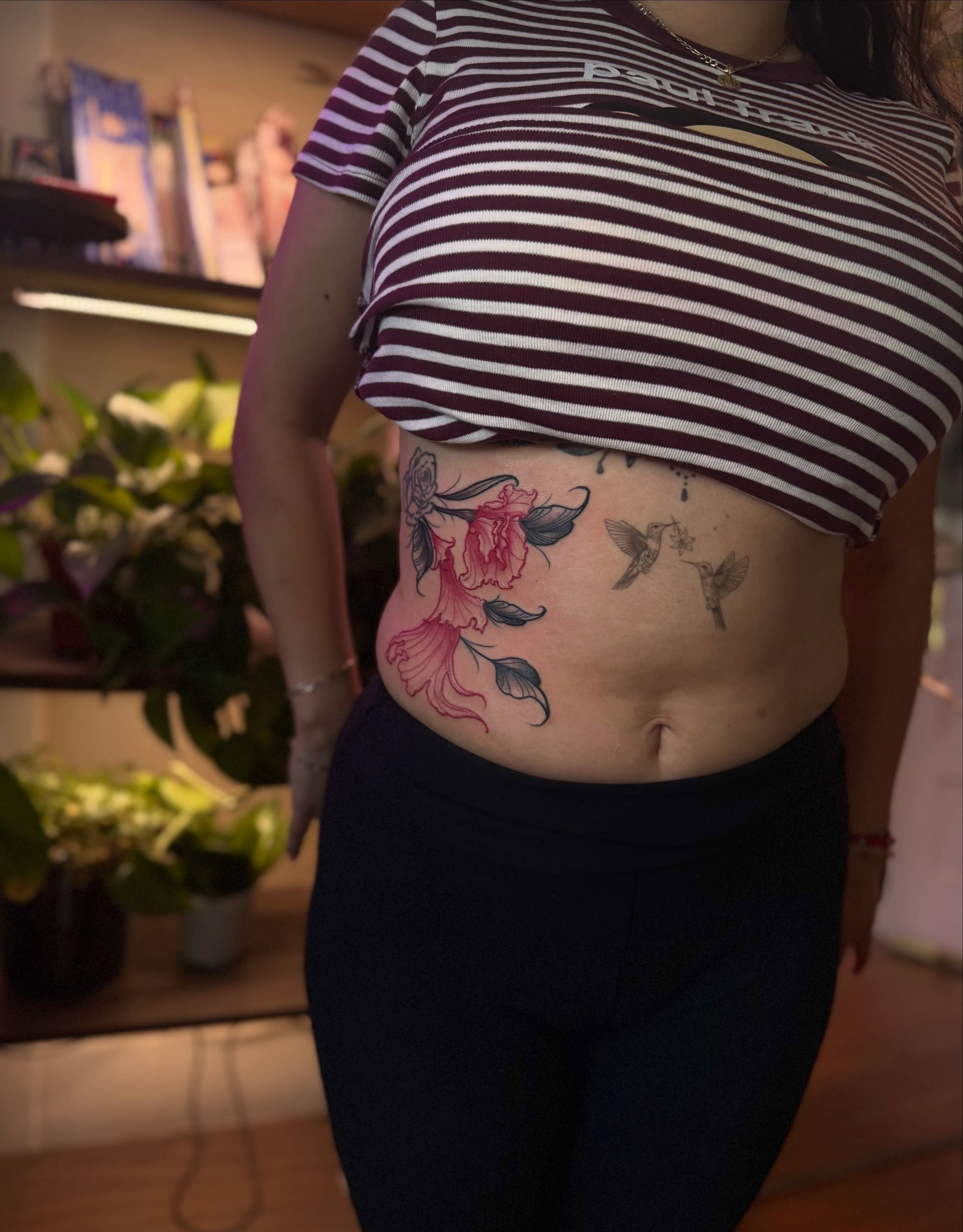 Peony and hummingbirds new school tattoo on the torso by Angie Cotton