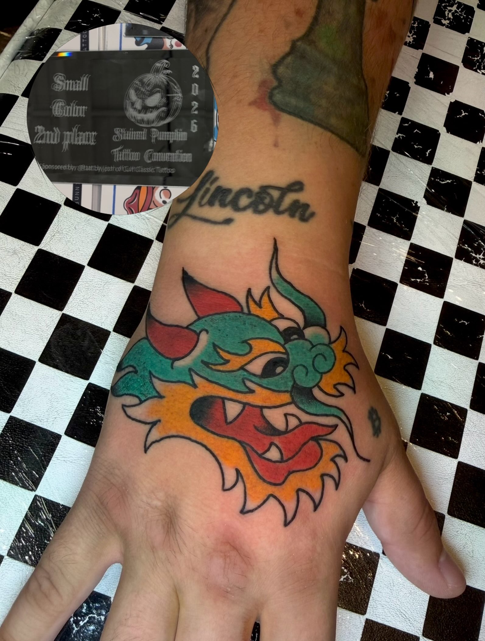 Dragon head American traditional tattoo on the hand by Dustie Pitstick