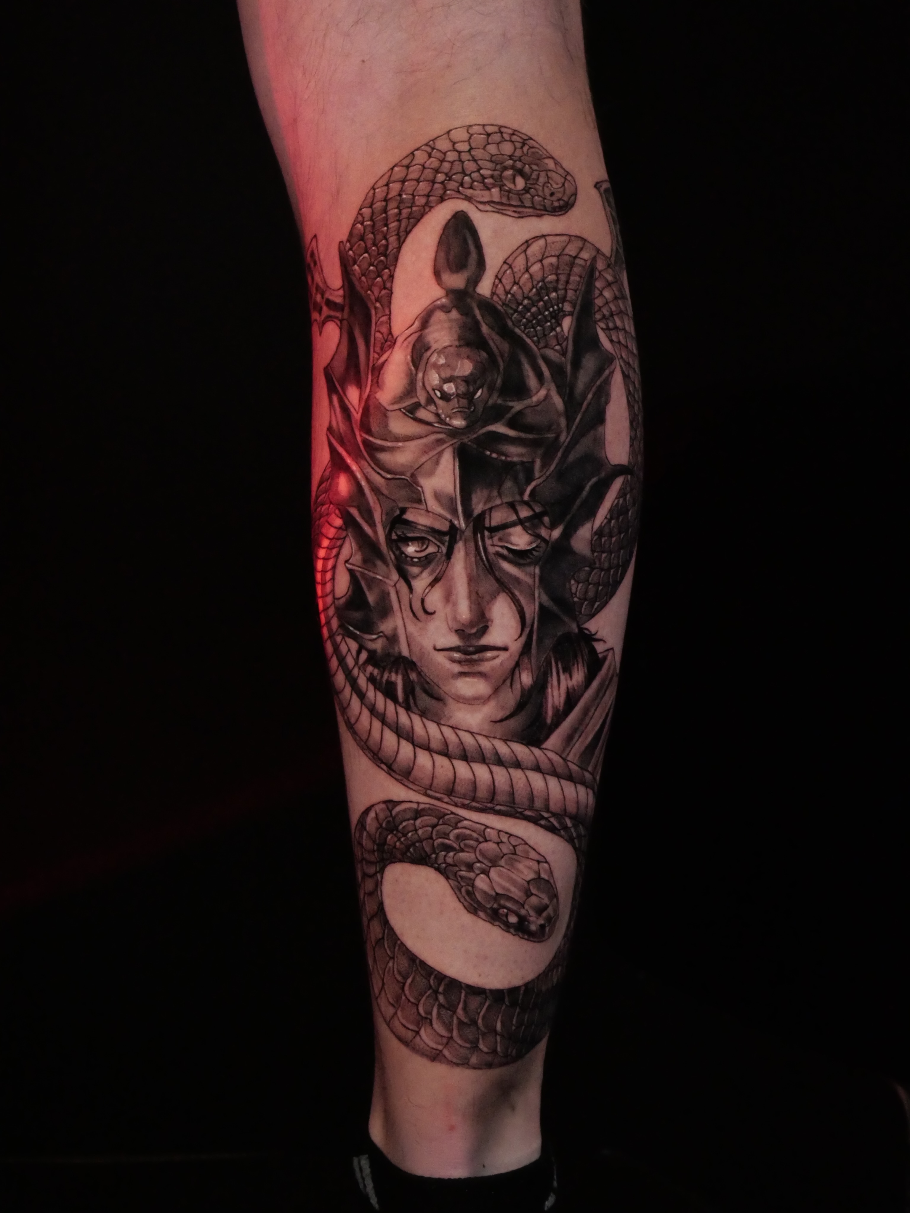 Snake and woman realism tattoo on the forearm by Sloppy