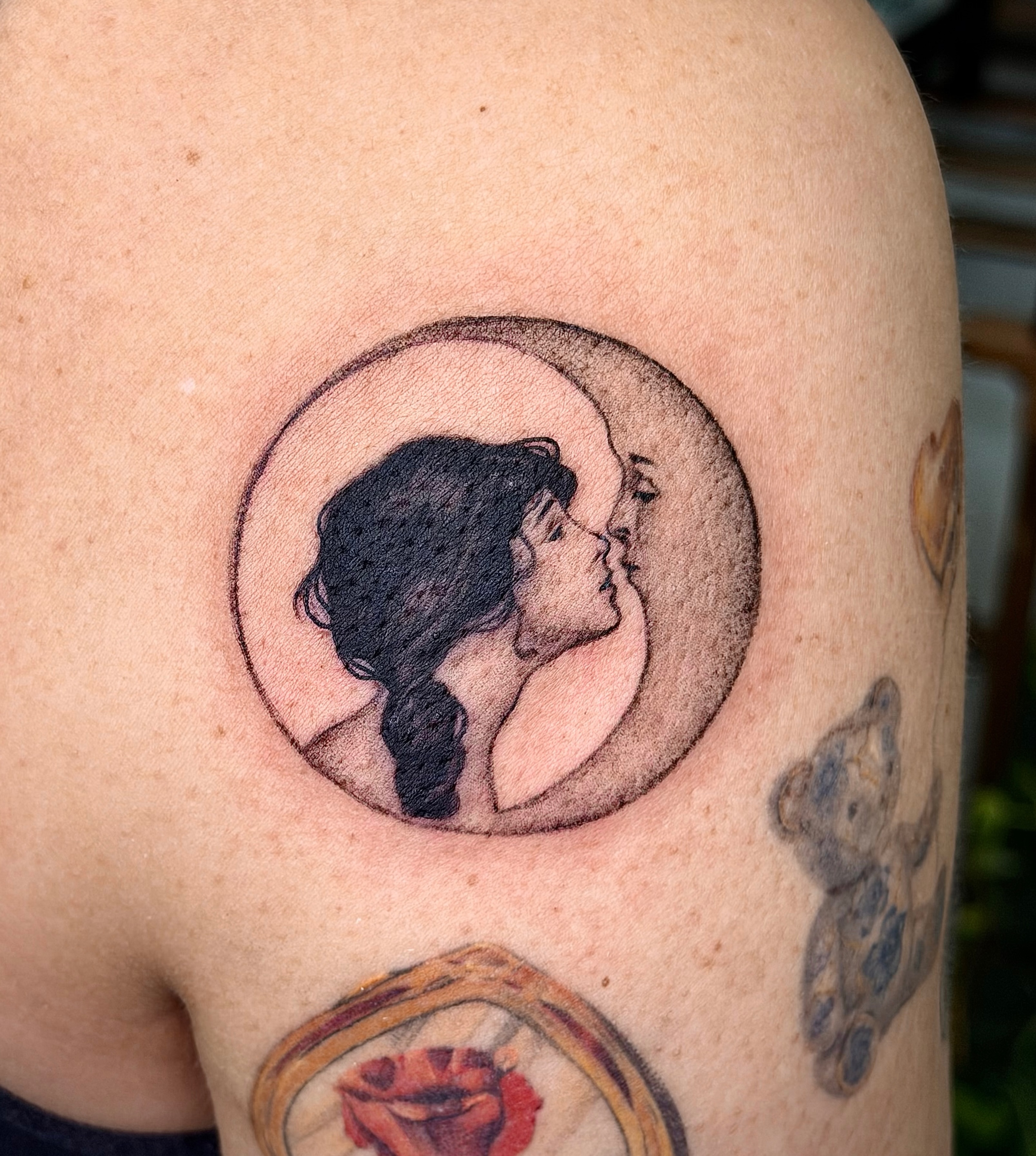 Couple kissing dotwork tattoo on the shoulder by Xin Huang