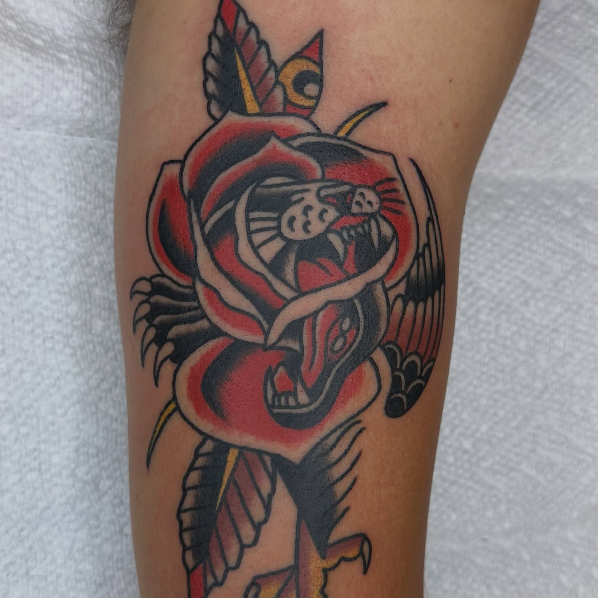 Dragon and rose American traditional tattoo on the forearm by Keon Ostby, Tempe, Arizona