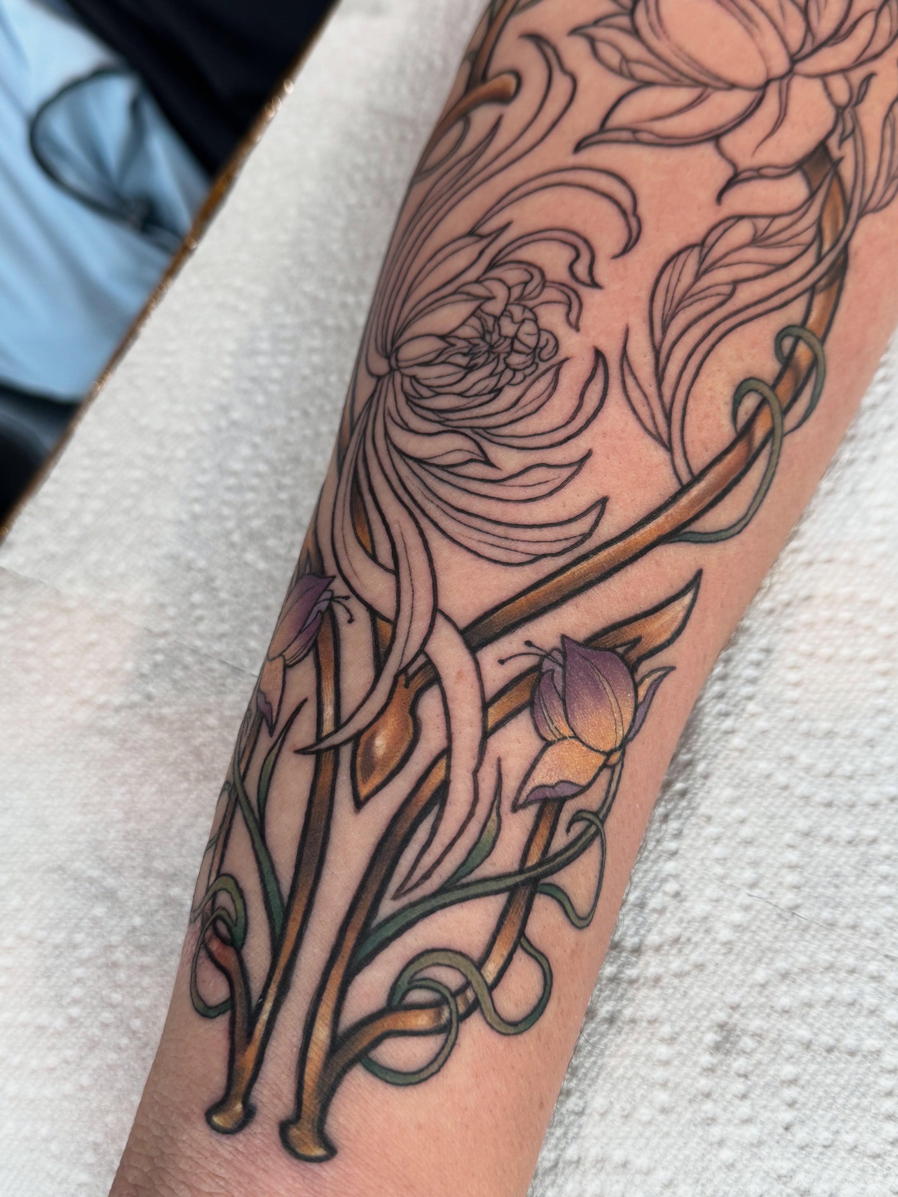 Floral arrangement black and grey tattoo on the forearm by Glory Pechonis πΏ