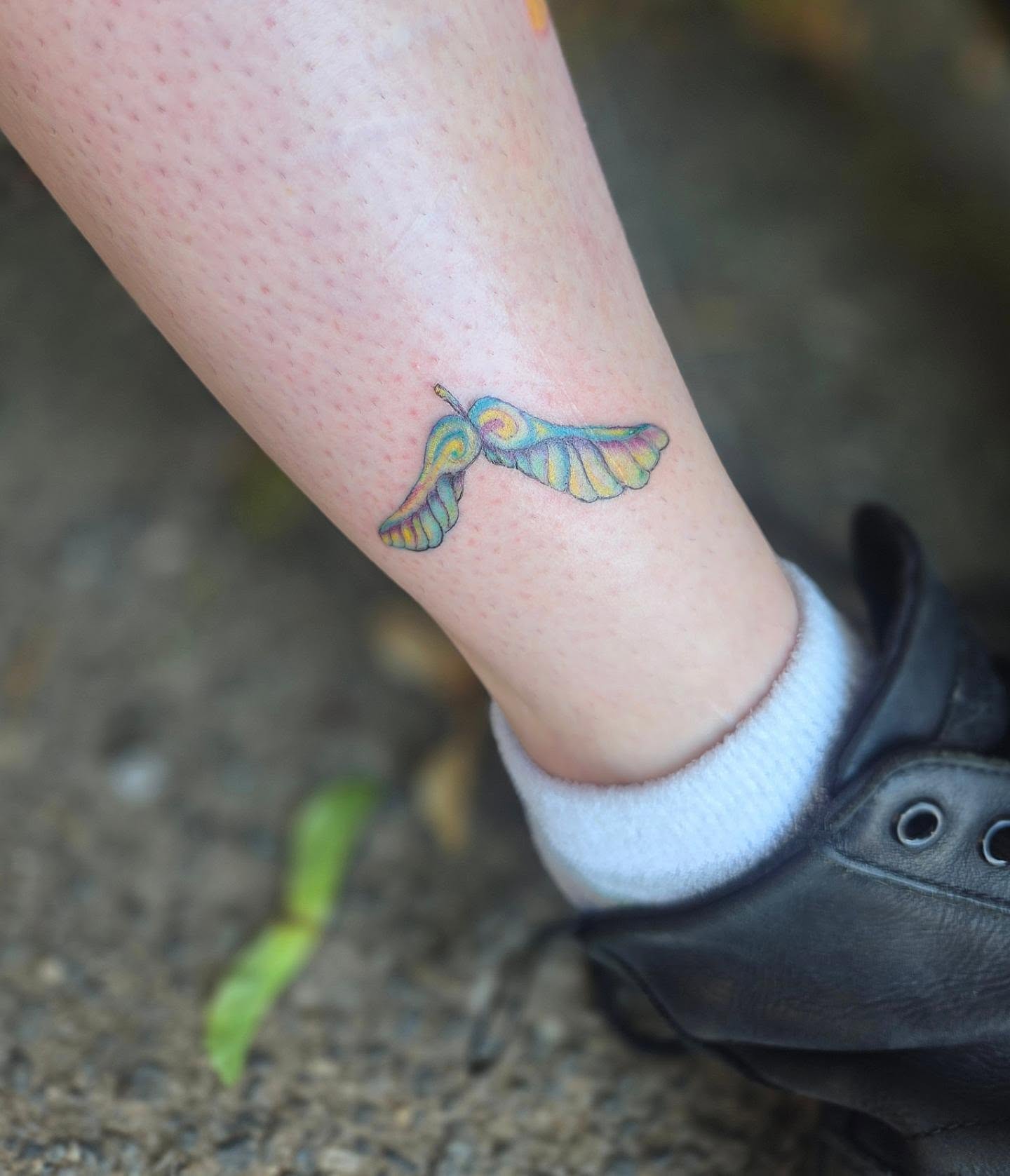 Butterfly new school tattoo on the forearm by Molly DeSmedt