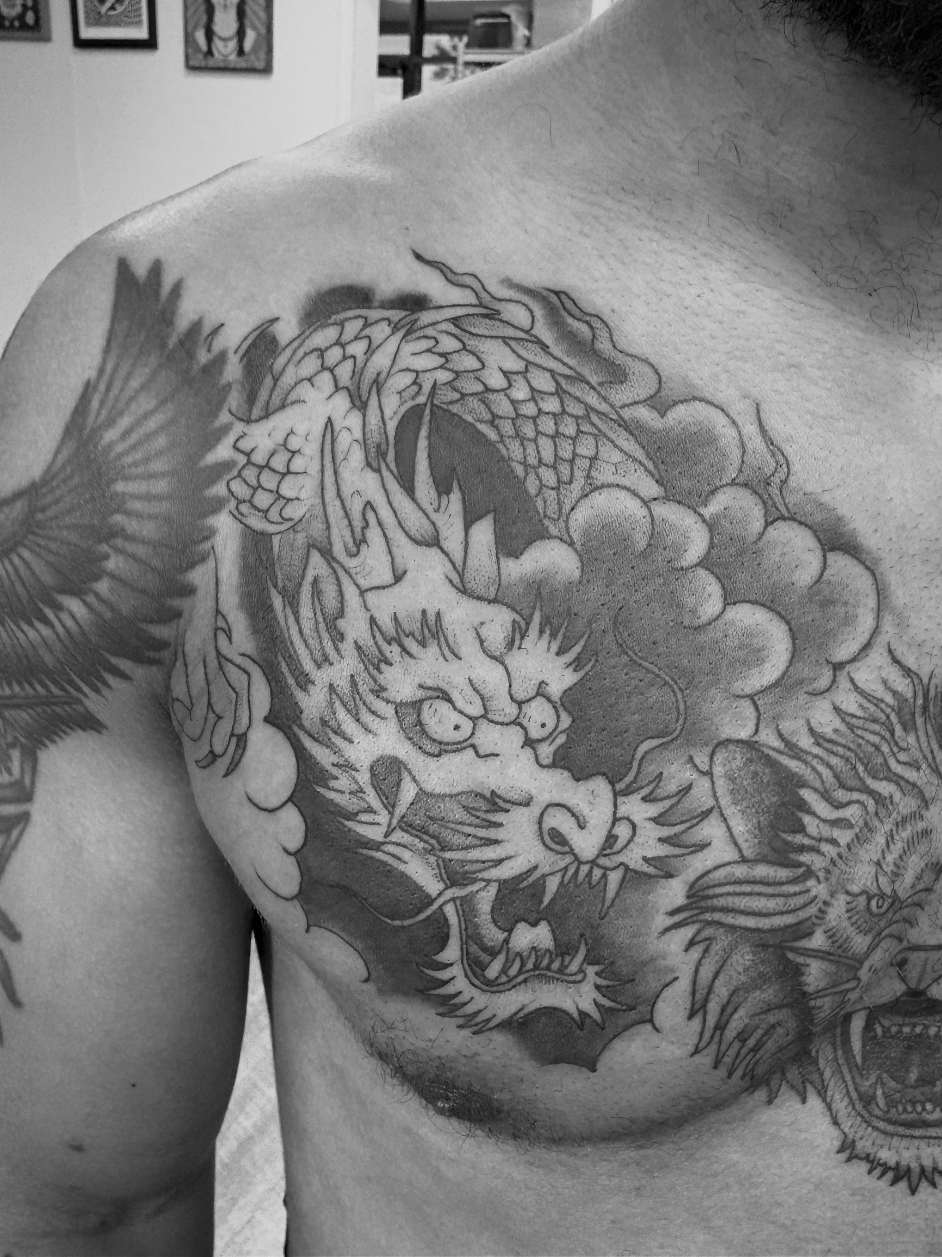 Dragon black and grey tattoo on the chest by Jason Allen, Avondale, Arizona
