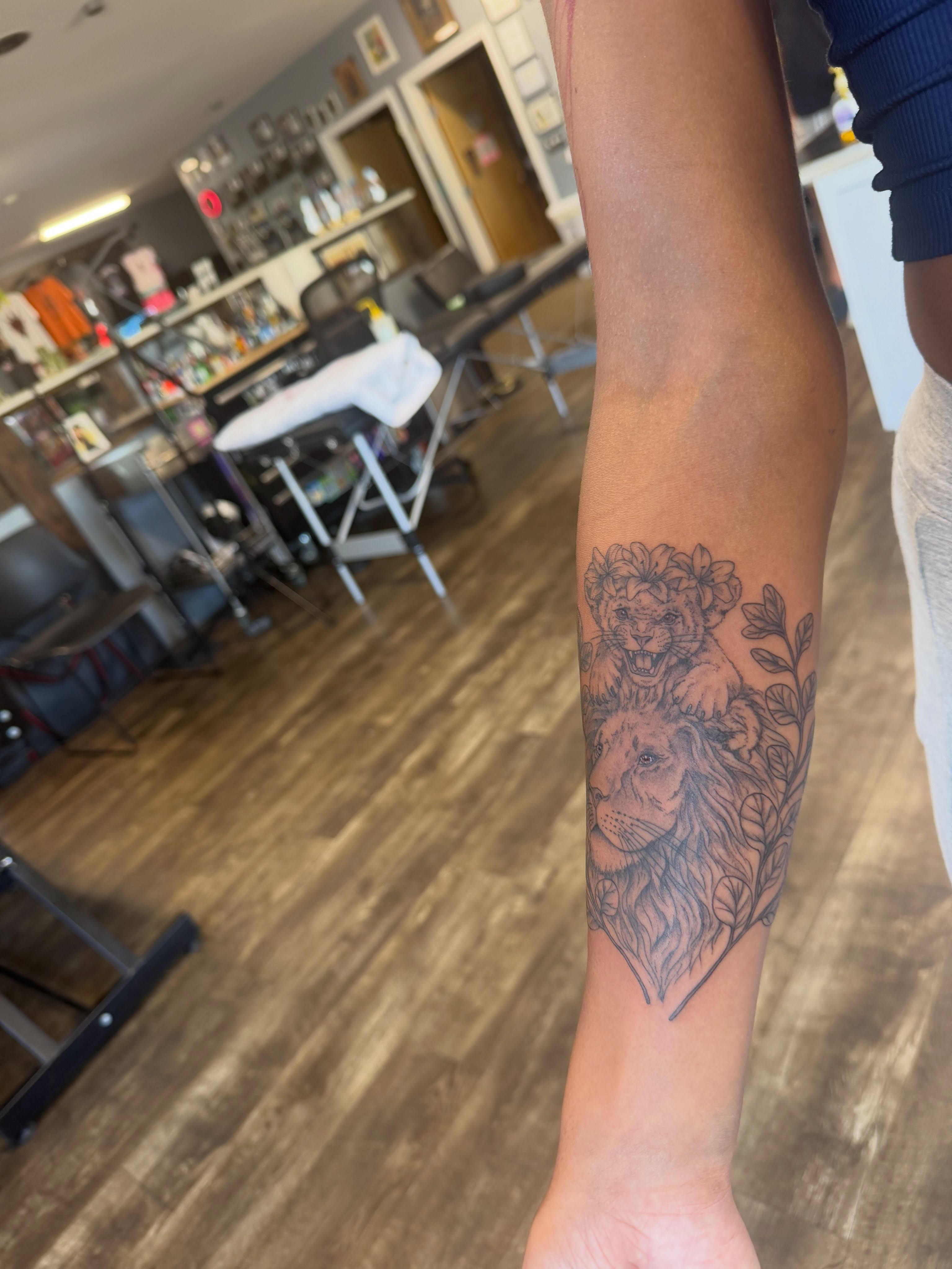 Lion and cub black and grey tattoo on the forearm by Hope Powell, Vancouver, Washington