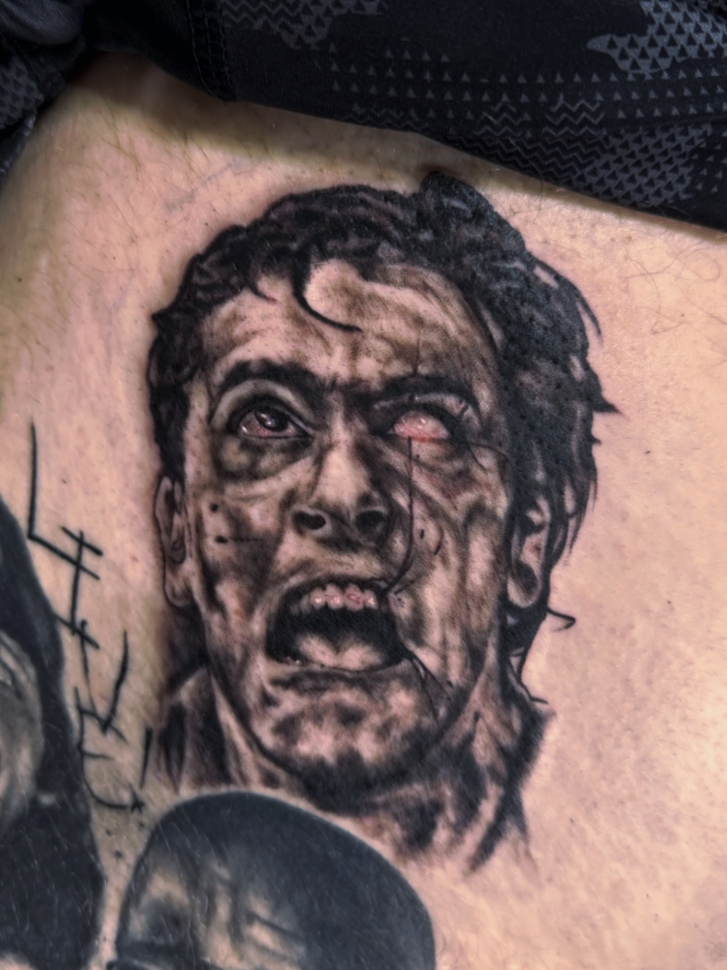 Zombie realism tattoo on the torso by Josh Kronauer