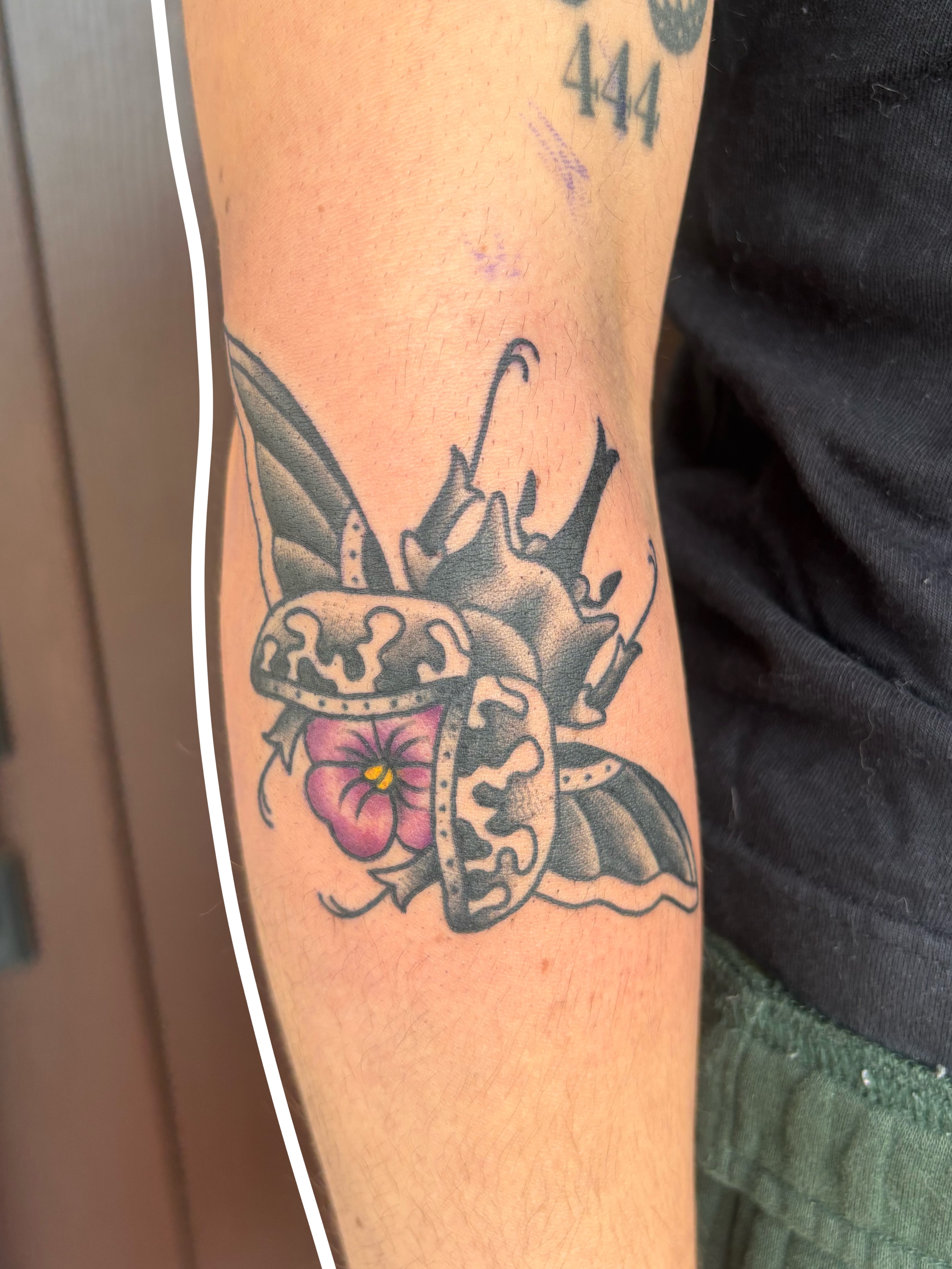Butterfly crown American traditional tattoo on the forearm by Emmy Stepien