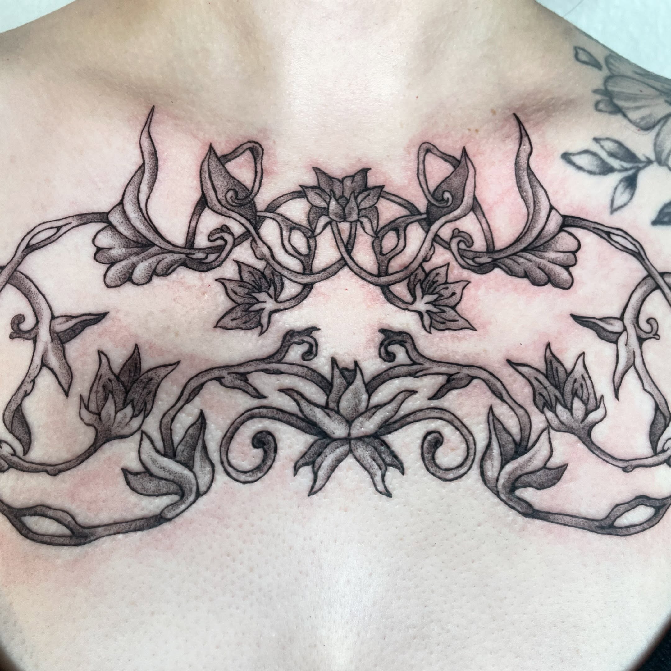 Floral vine ornamental tattoo on the chest by sara ‧⭑𓆝 𓆟 𓆞 𓆝 𓆟 ⭑‧₊