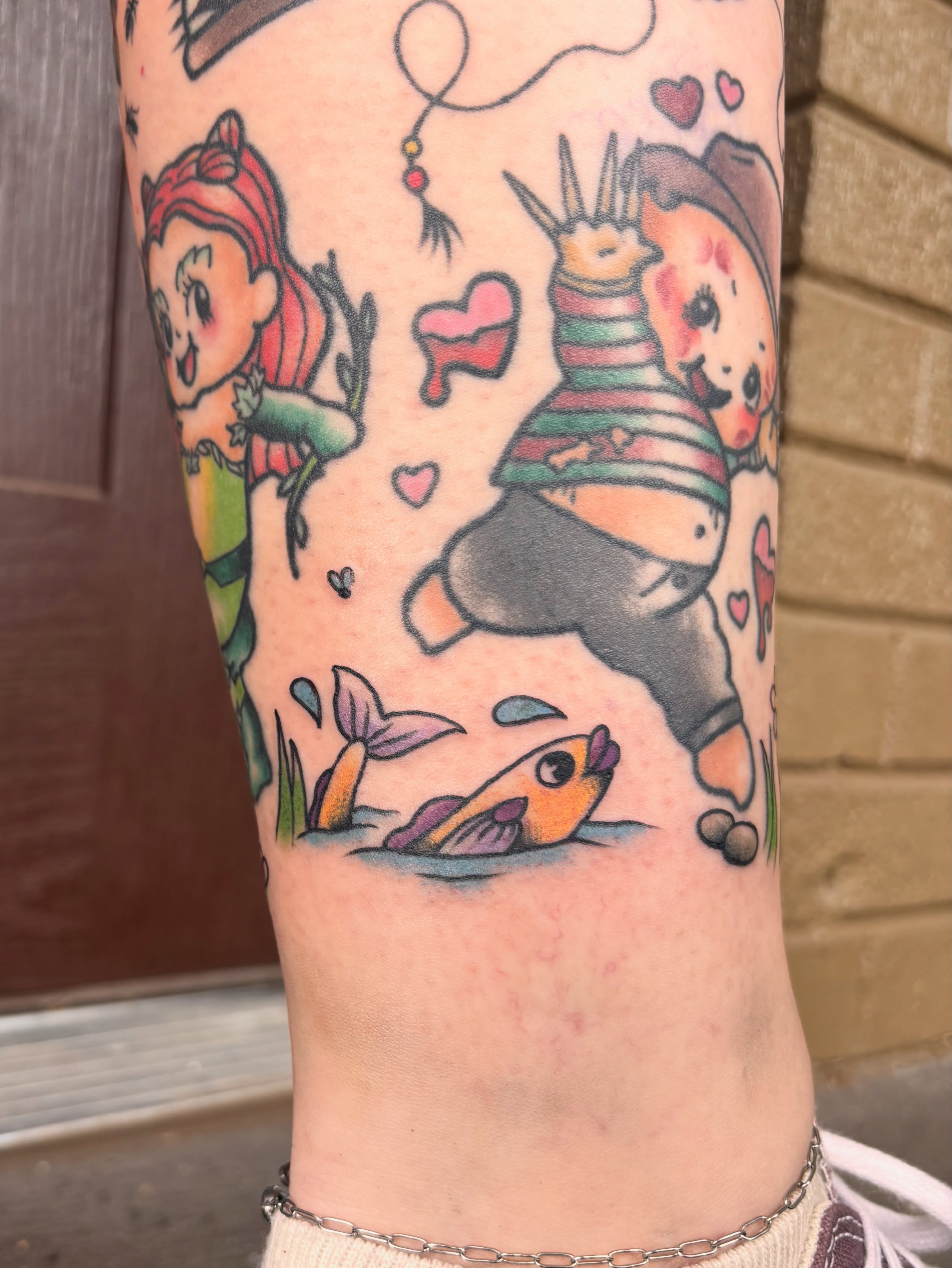 Mermaid and clownfish new school tattoo on the forearm by Emmy Stepien