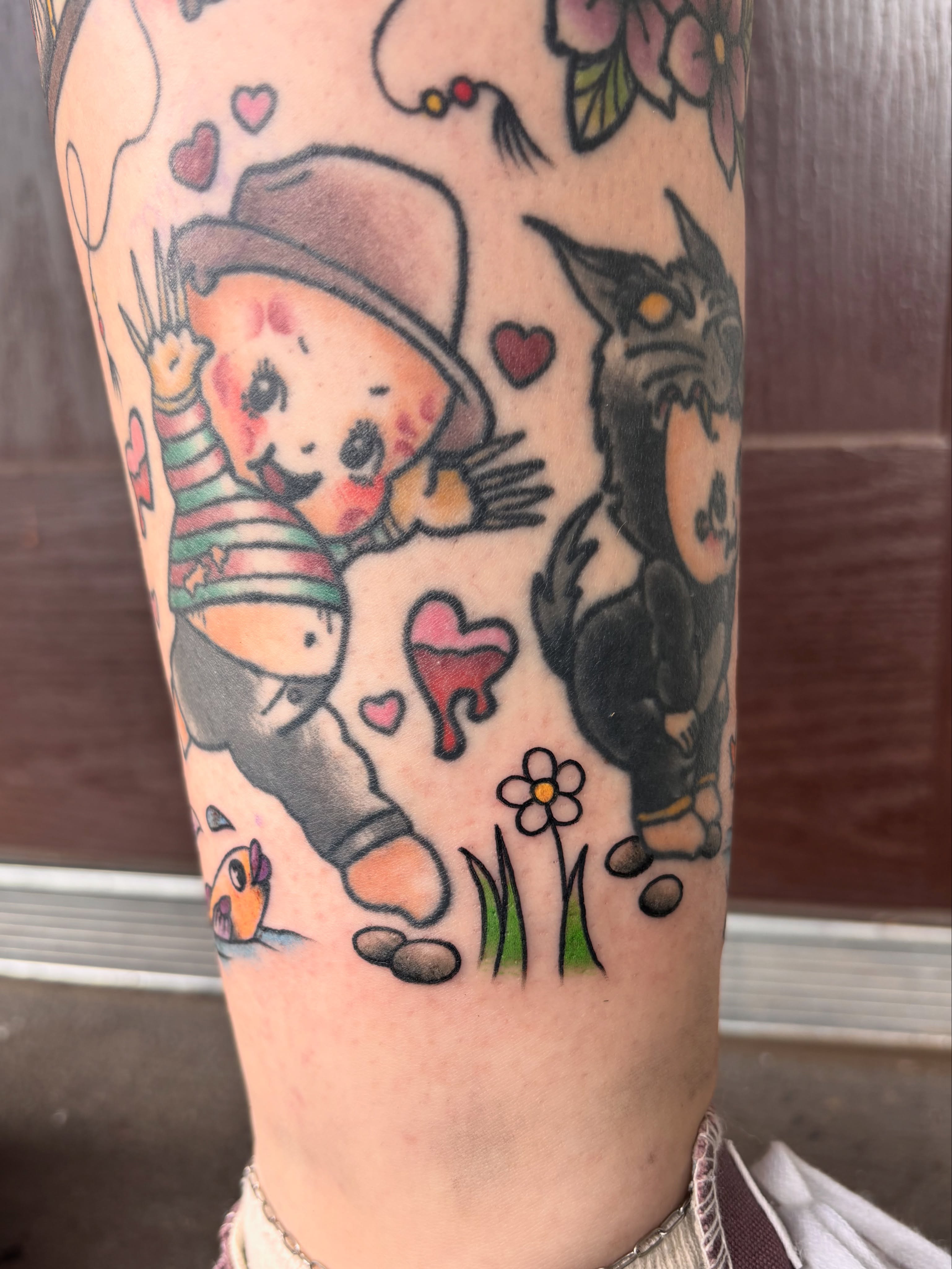 Scarecrow and wolf American traditional tattoo on the forearm by Emmy Stepien