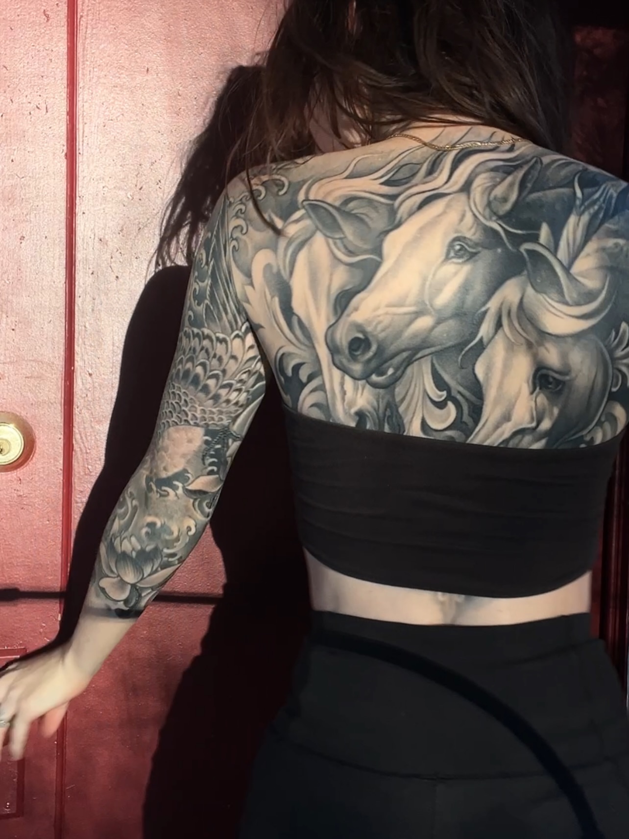 Horses realism tattoo on the back by Tattoo Artist Mimzi PMA