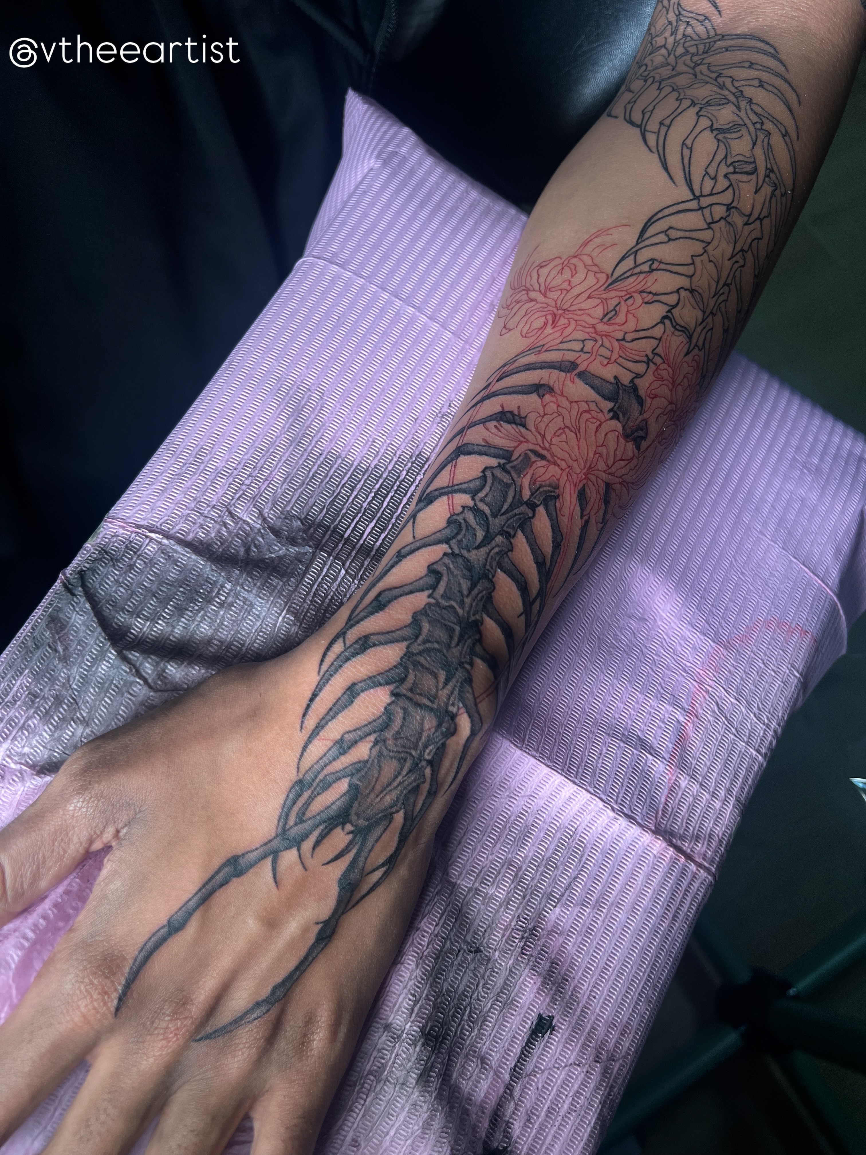Spine and flowers black and grey tattoo on the forearm by V
