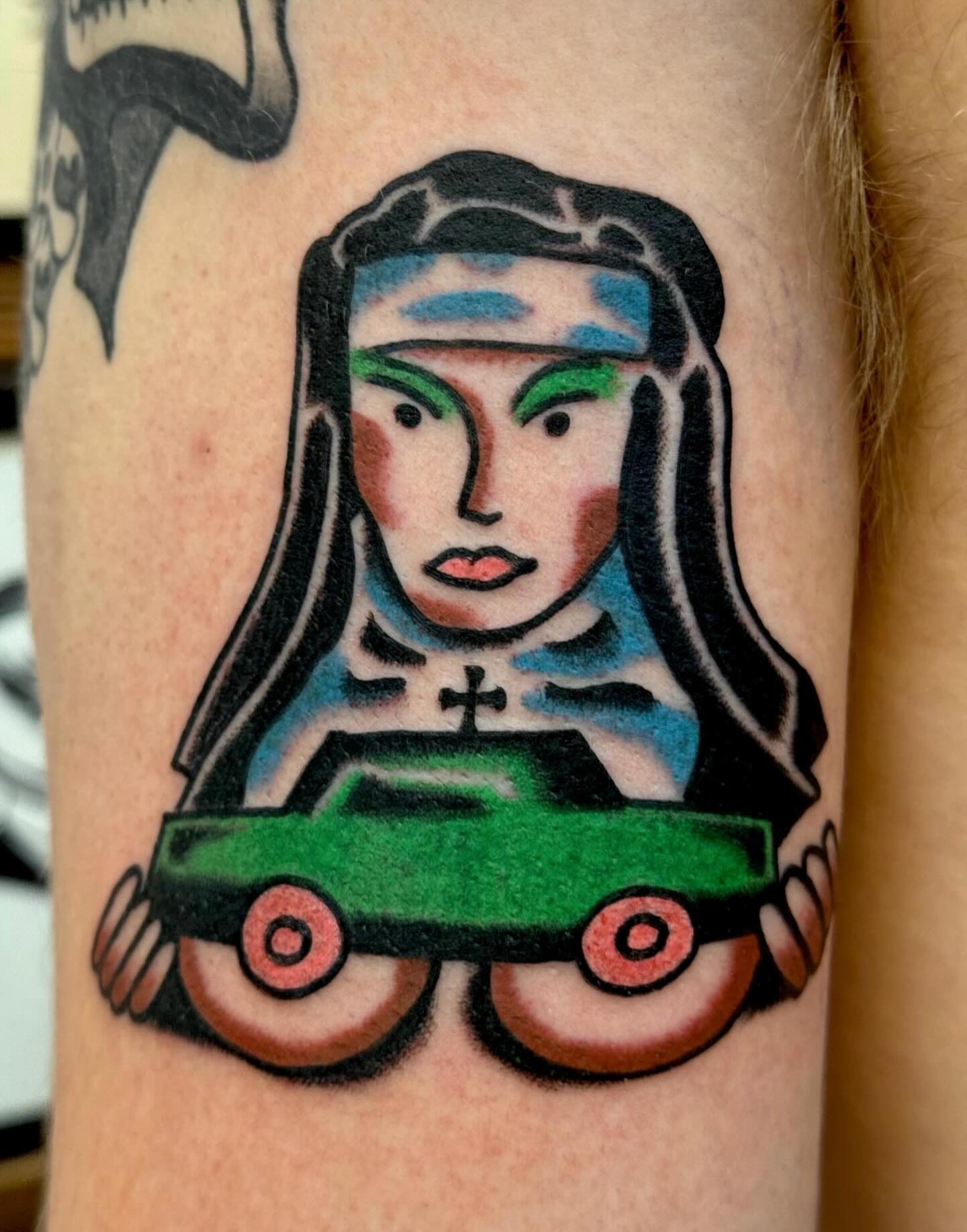 Nun with toy car American traditional tattoo on the forearm by JAX