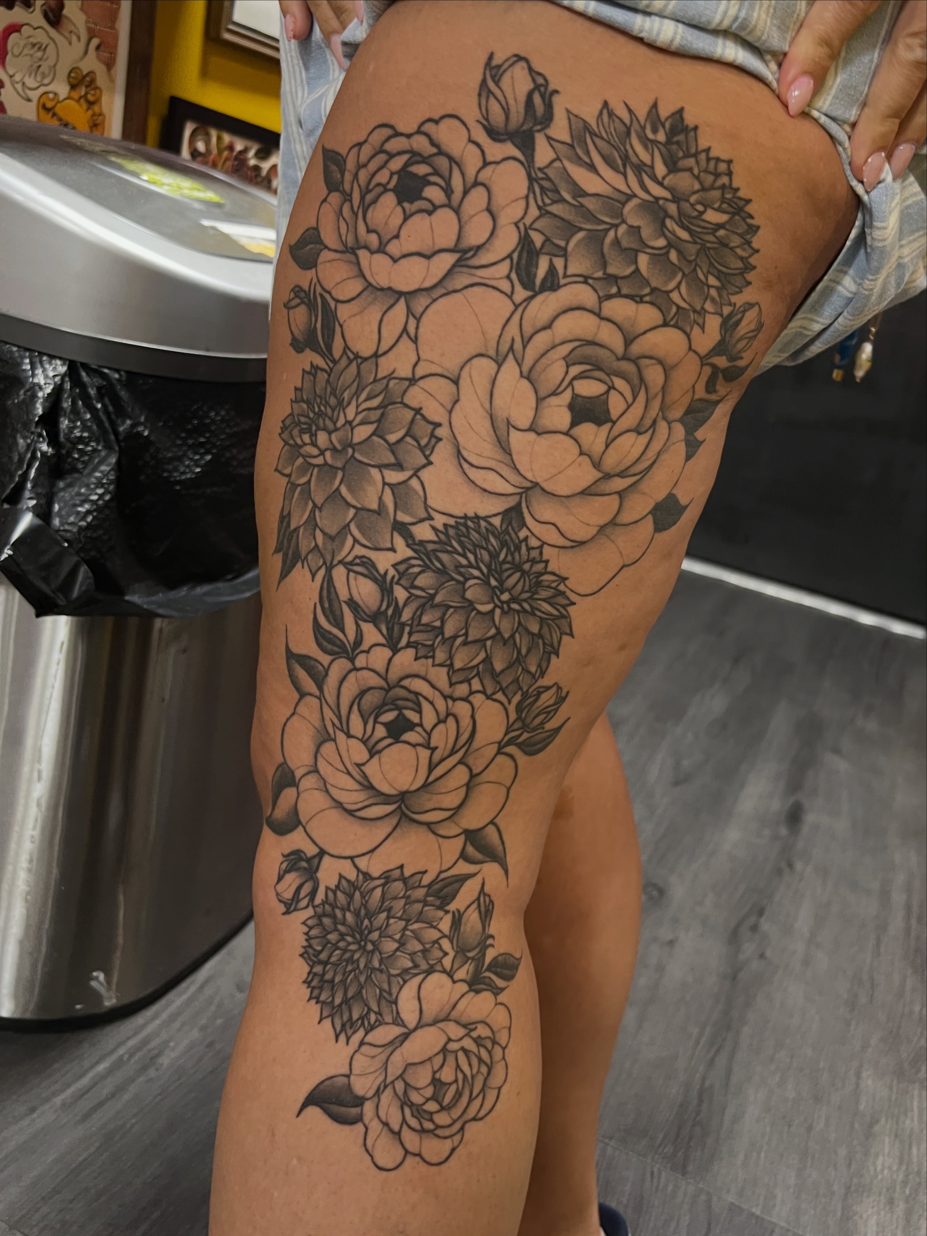 Floral bouquet black and grey tattoo on the thigh by Blair Schwartz, Asbury Park, New Jersey