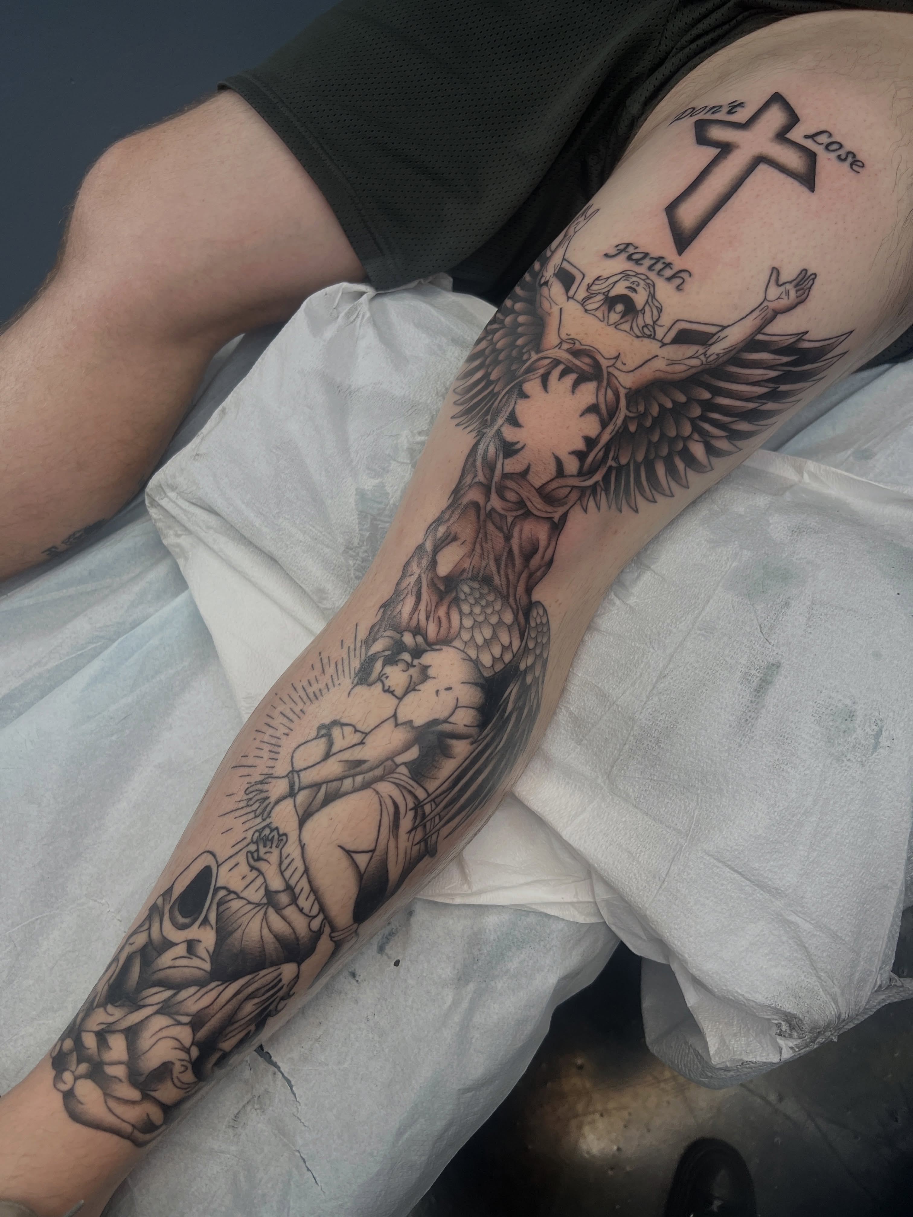 Religious crucifixion scene realism tattoo on the forearm by Blair Schwartz, Asbury Park, New Jersey