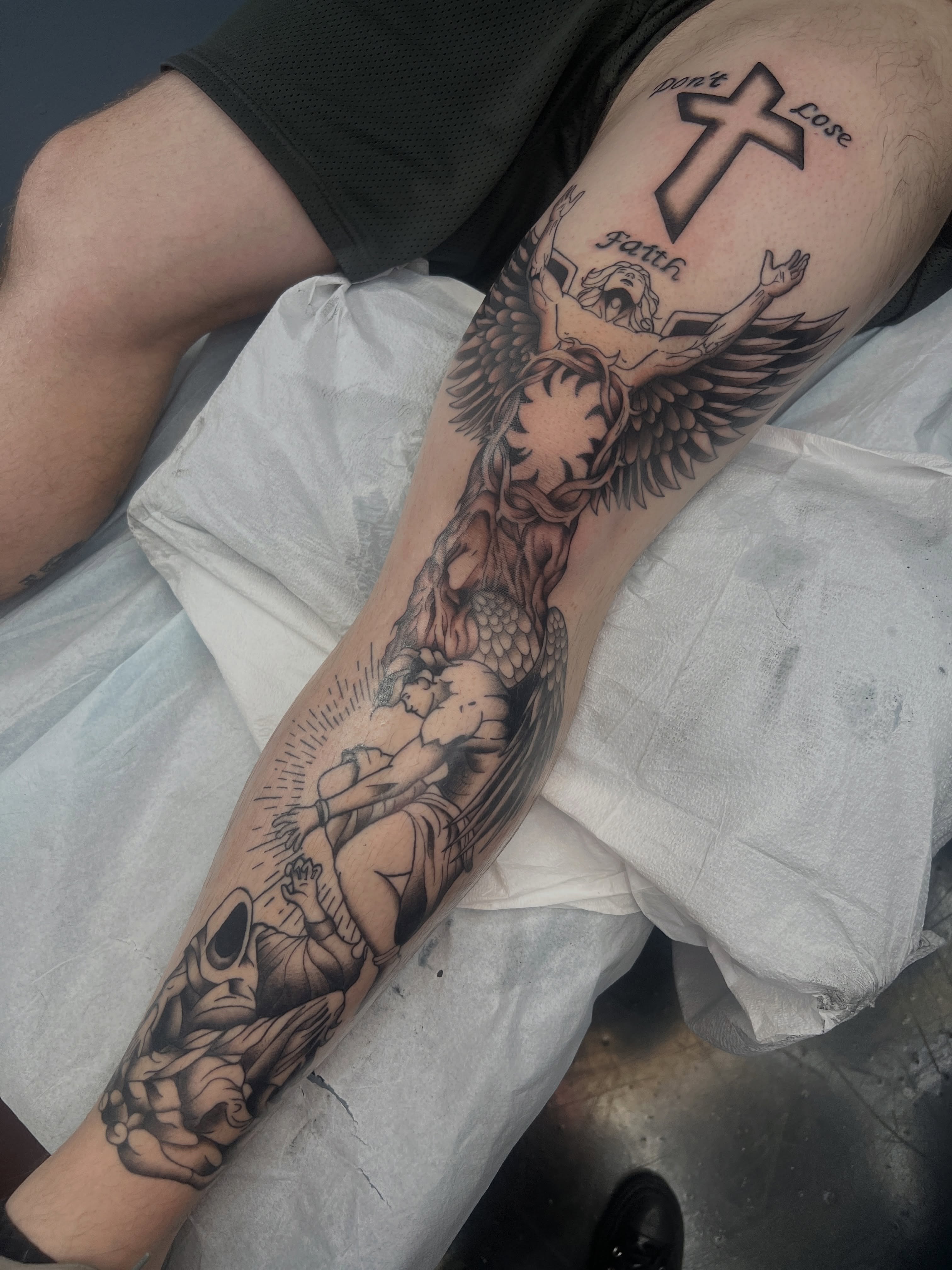 Religious crucifixion scene realism tattoo on the forearm by Blair Schwartz, Asbury Park, New Jersey