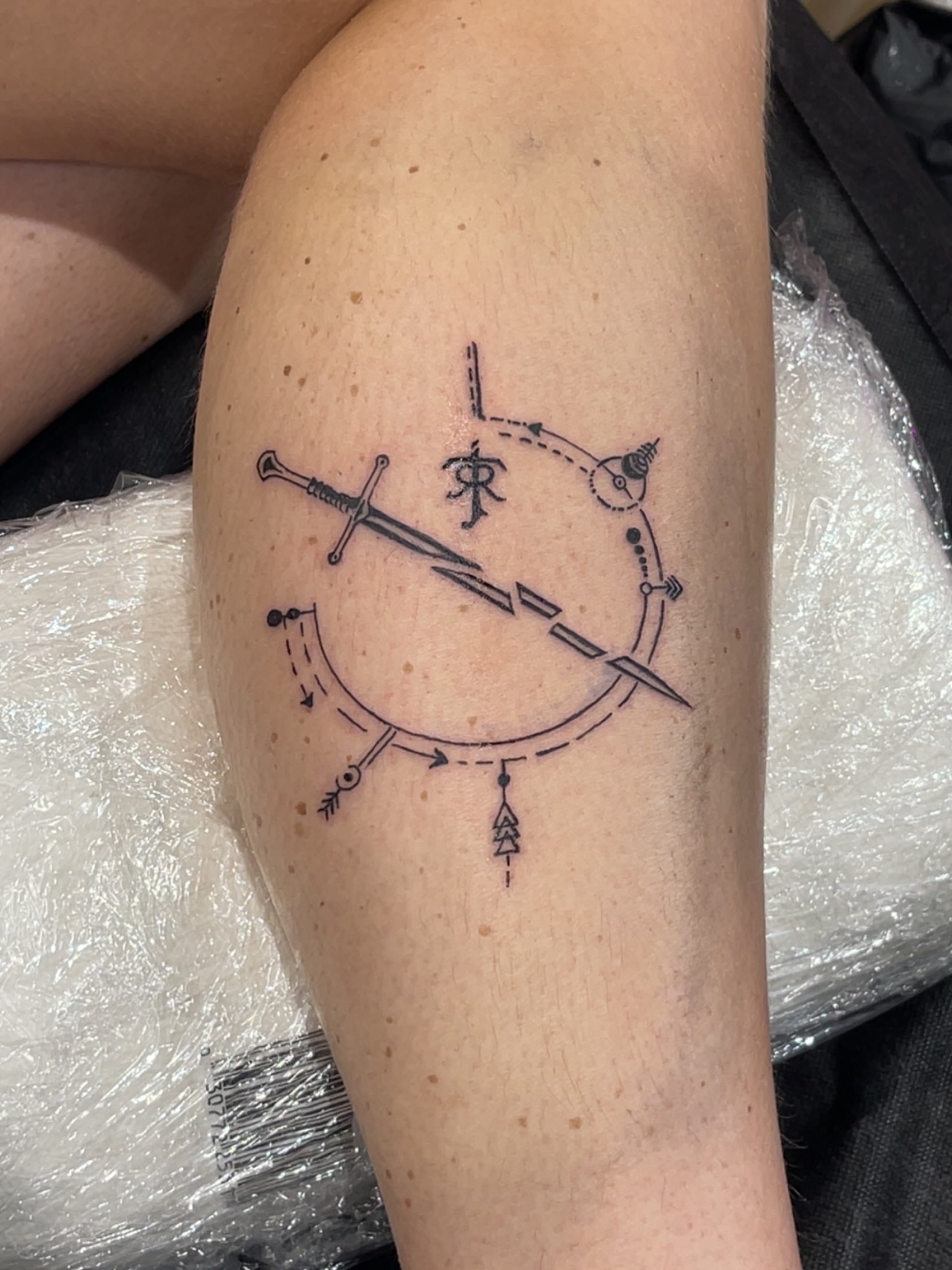 Compass and sword geometric tattoo on the forearm by Tattsruru