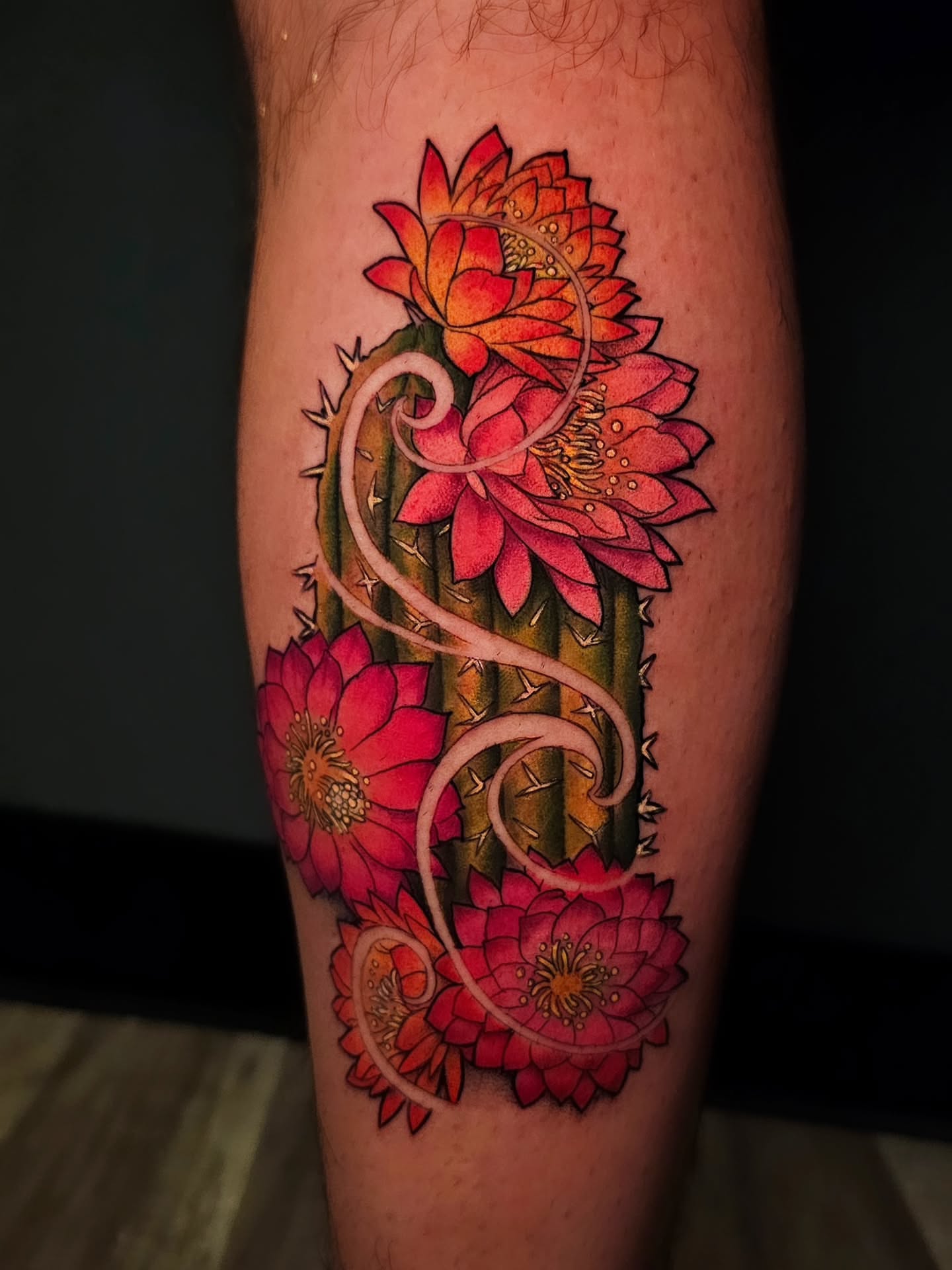 Cactus with flowers realism tattoo on the forearm by Adriannah Esparza