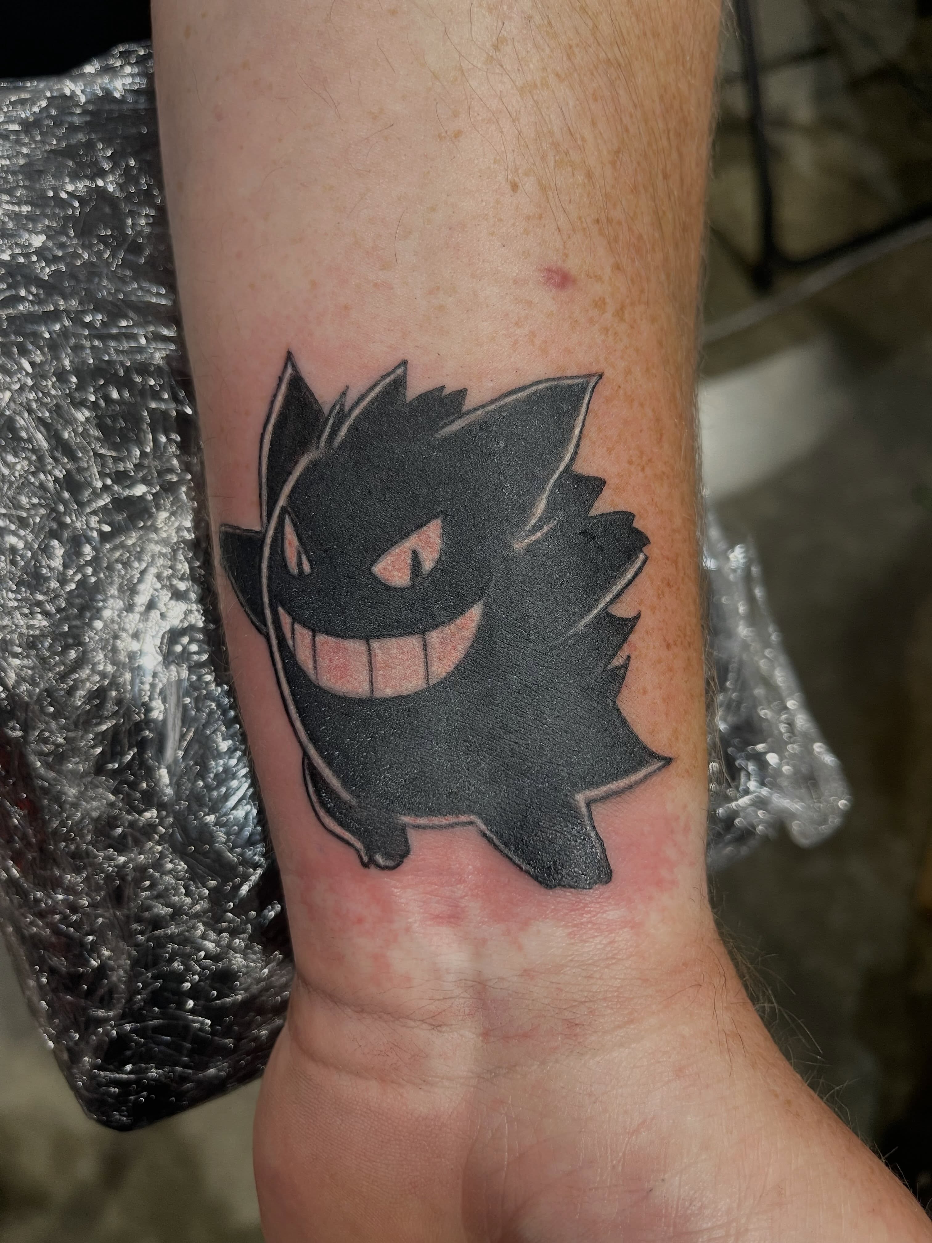 Gengar black and grey tattoo on the forearm by Tattsruru