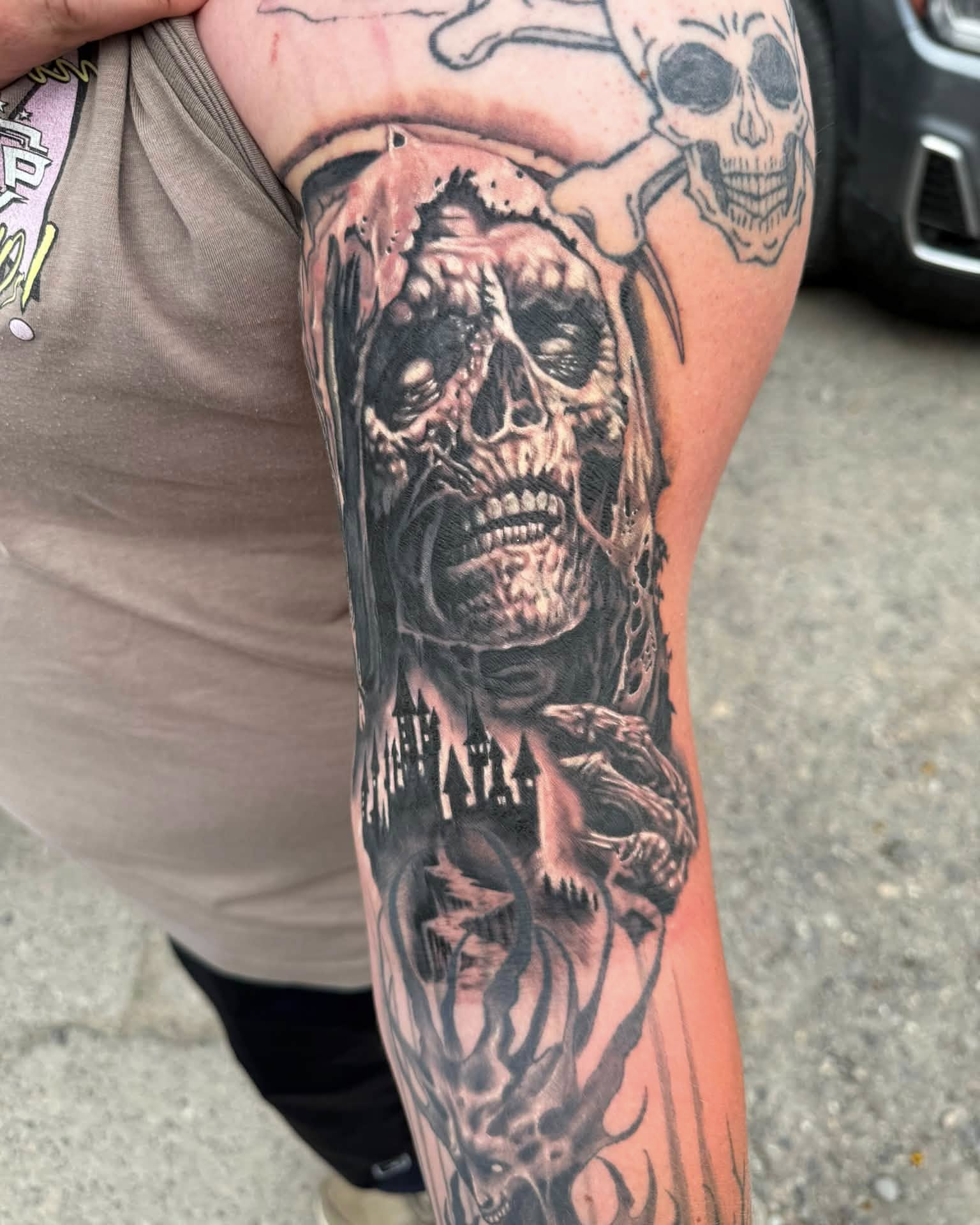 Tattoo by @kenzi.tattoo — dark_realism, black_and_grey