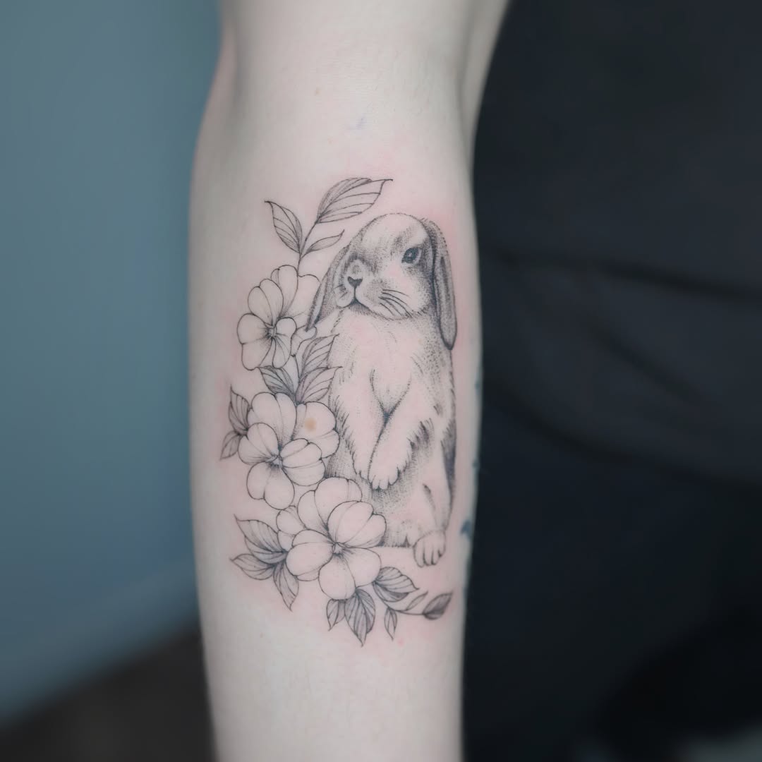 Rabbit and flowers dotwork tattoo on the forearm by Seattle tattoo artist-Mia