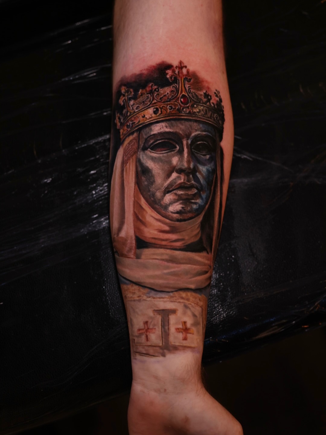 Royal figure realism tattoo on the forearm by Brandon Sontag
