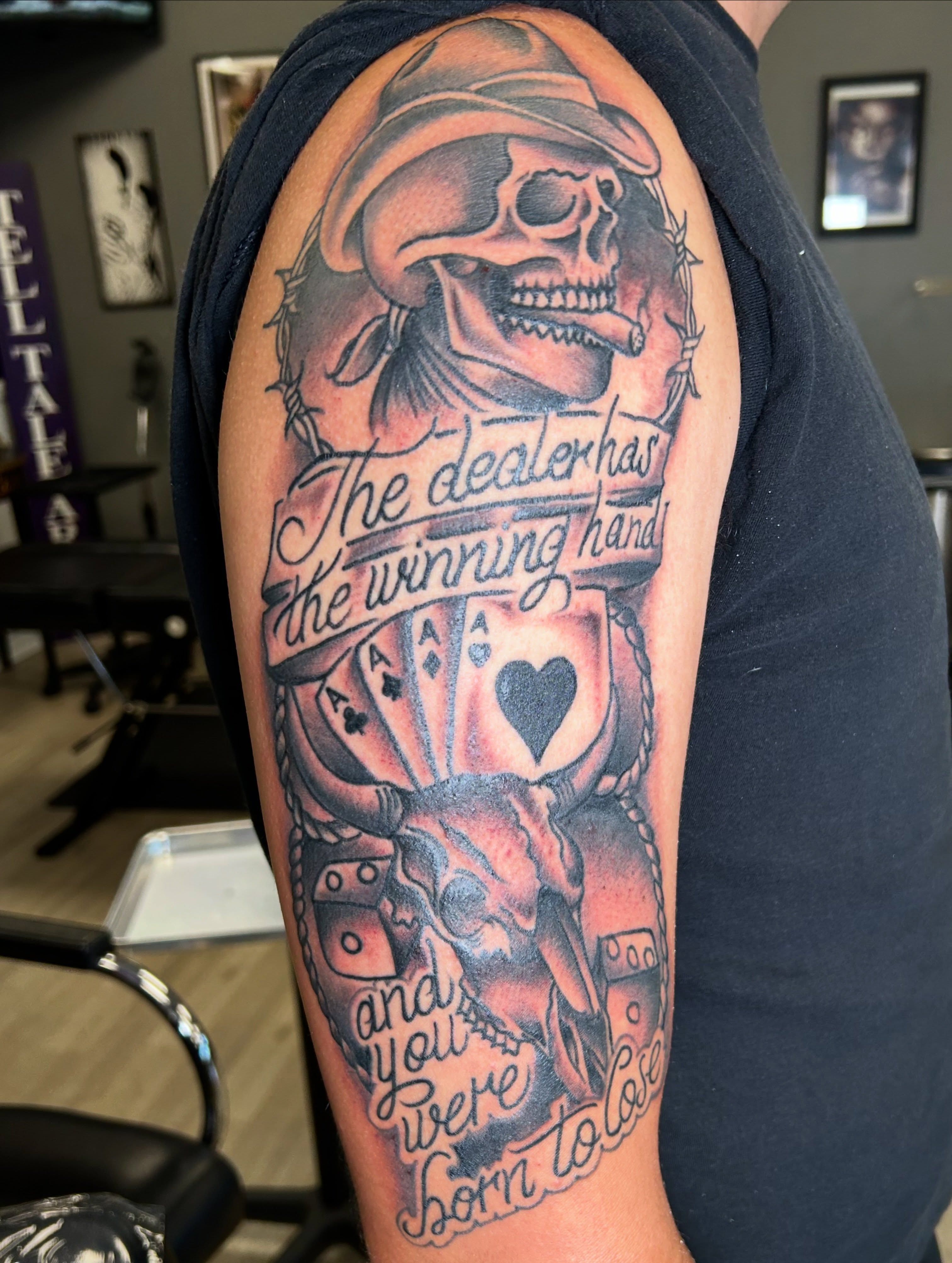 Skull with playing cards American traditional tattoo on the forearm by Erik Sacony