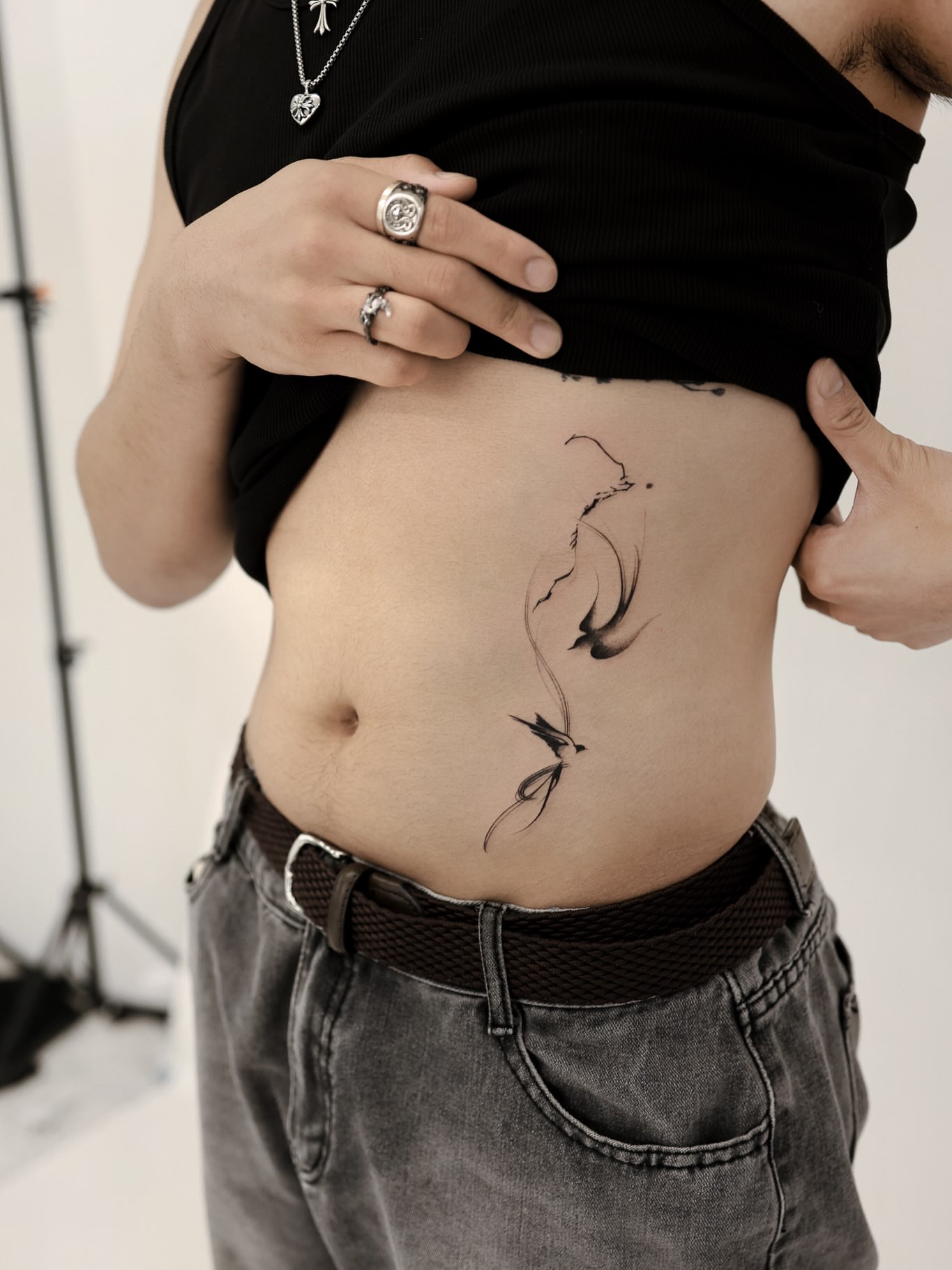 Abstract swirls black and grey tattoo on the torso by 초현실과 현실 그 사이를 그리다.