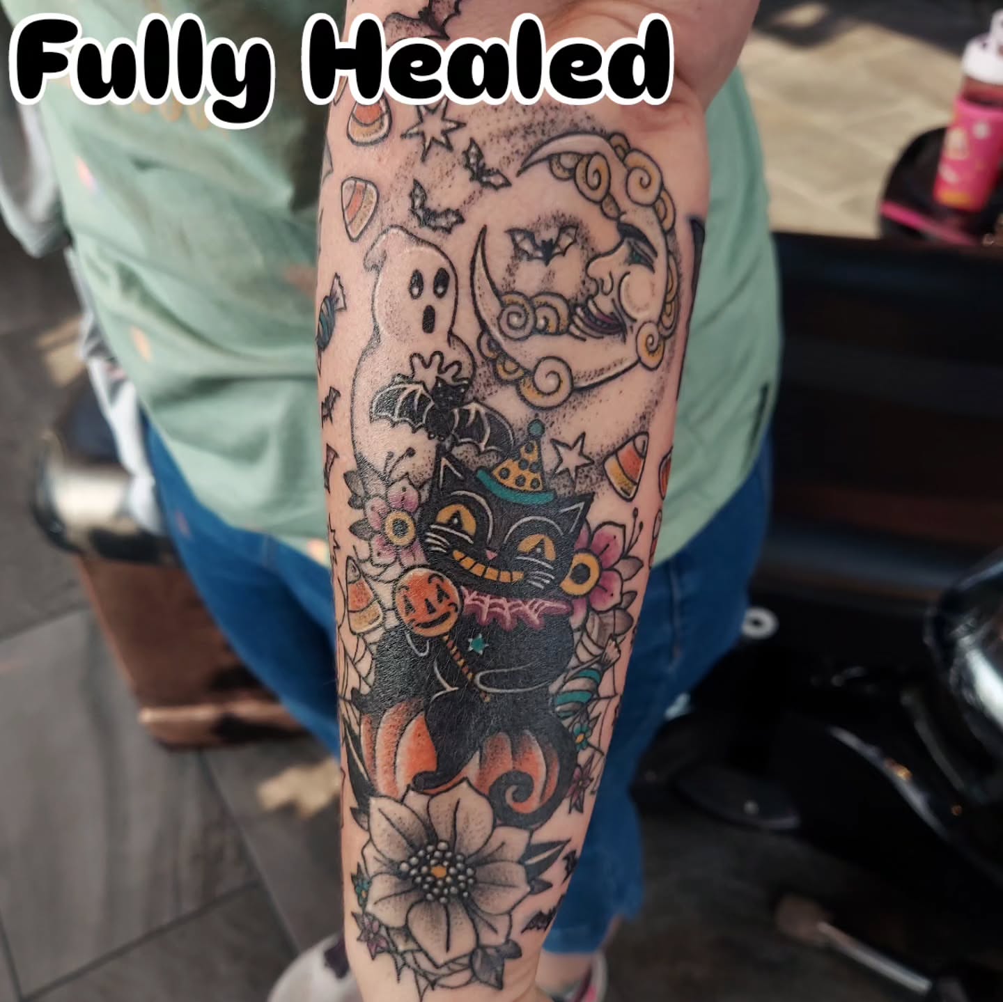 Halloween-themed tattoo American traditional tattoo on the forearm by Kari Rhoades, Marion, Iowa
