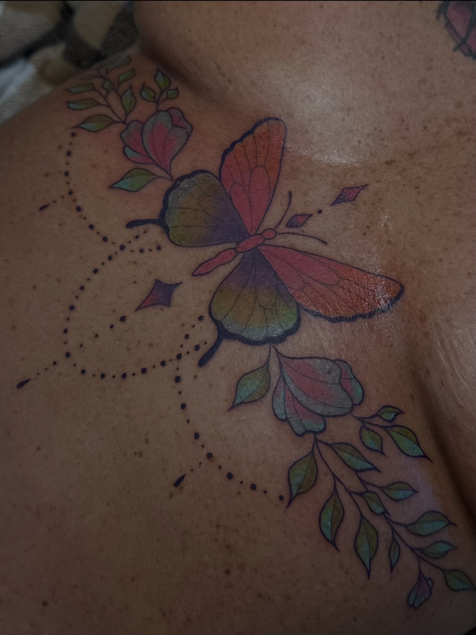 Butterfly and leaves dotwork tattoo on the shoulder by Maddie Neibert