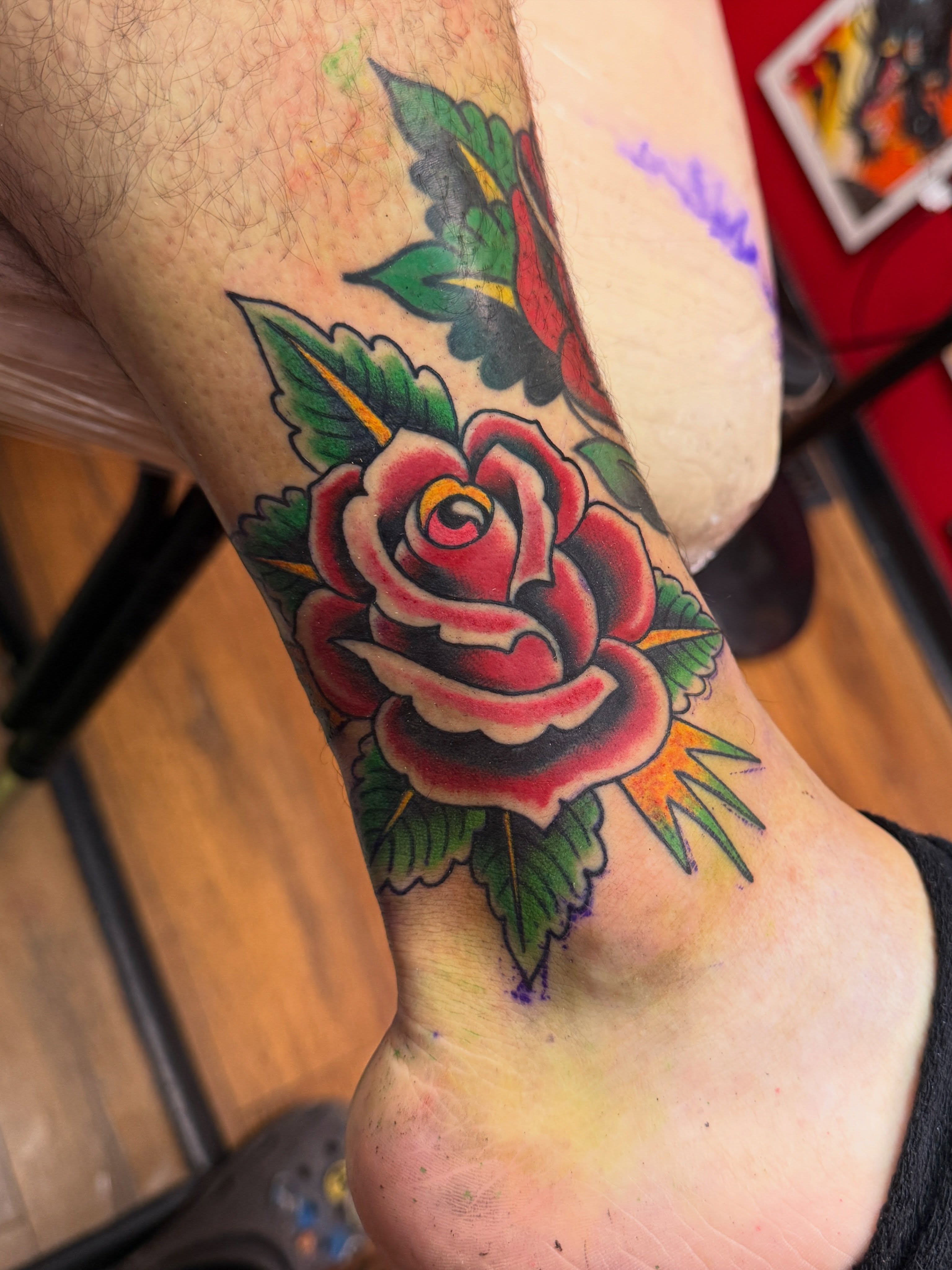 Rose American traditional tattoo on the calf by Angus Perfect, Philadelphia, Pennsylvania