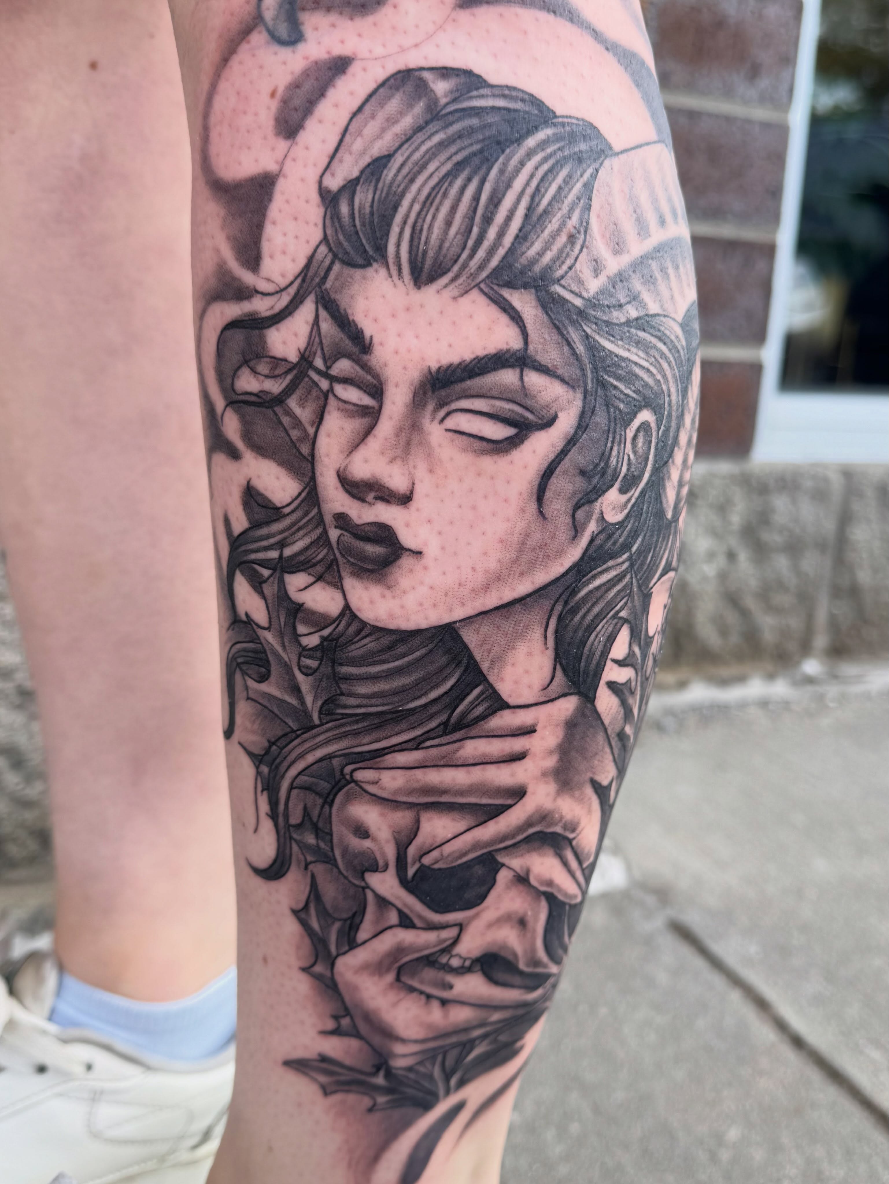 Woman with skull dotwork tattoo on the forearm by Nikki Powills