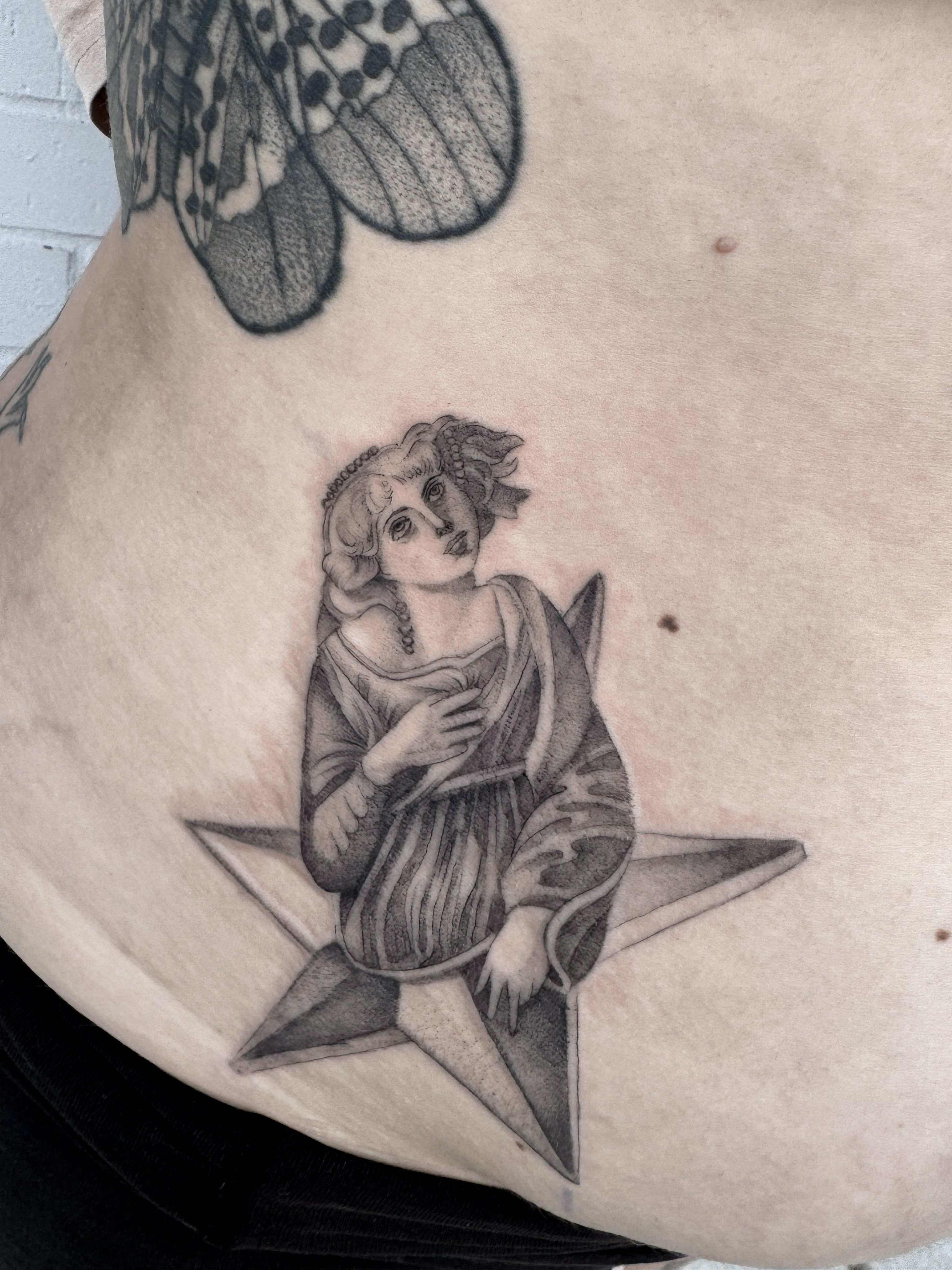 Angel black and grey tattoo on the torso by Audrey Kacel, Holland, Michigan