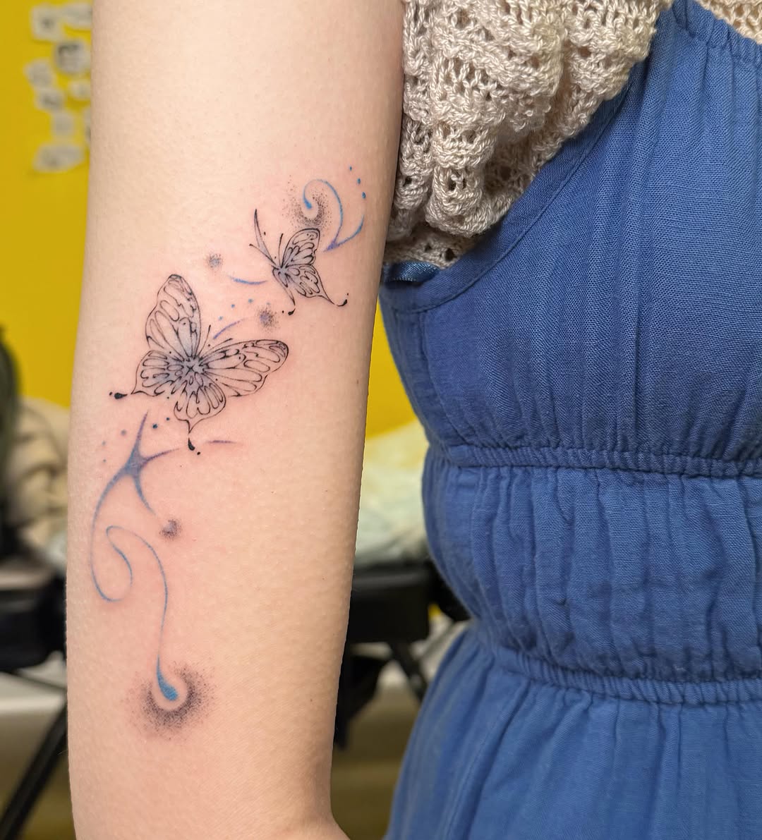 Butterflies dotwork tattoo on the forearm by Echo