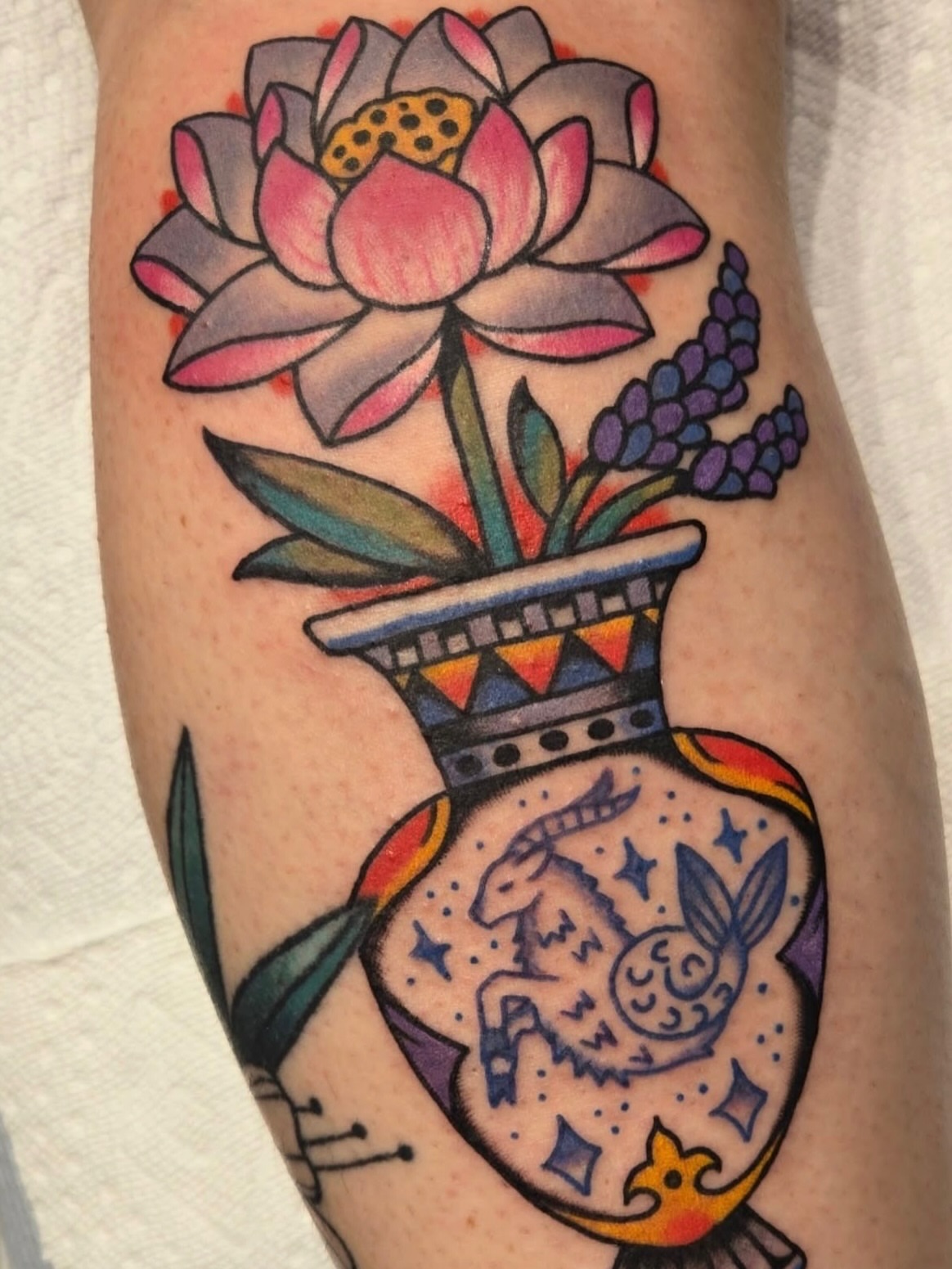 Lotus flower in vase American traditional tattoo on the forearm by Brenn
