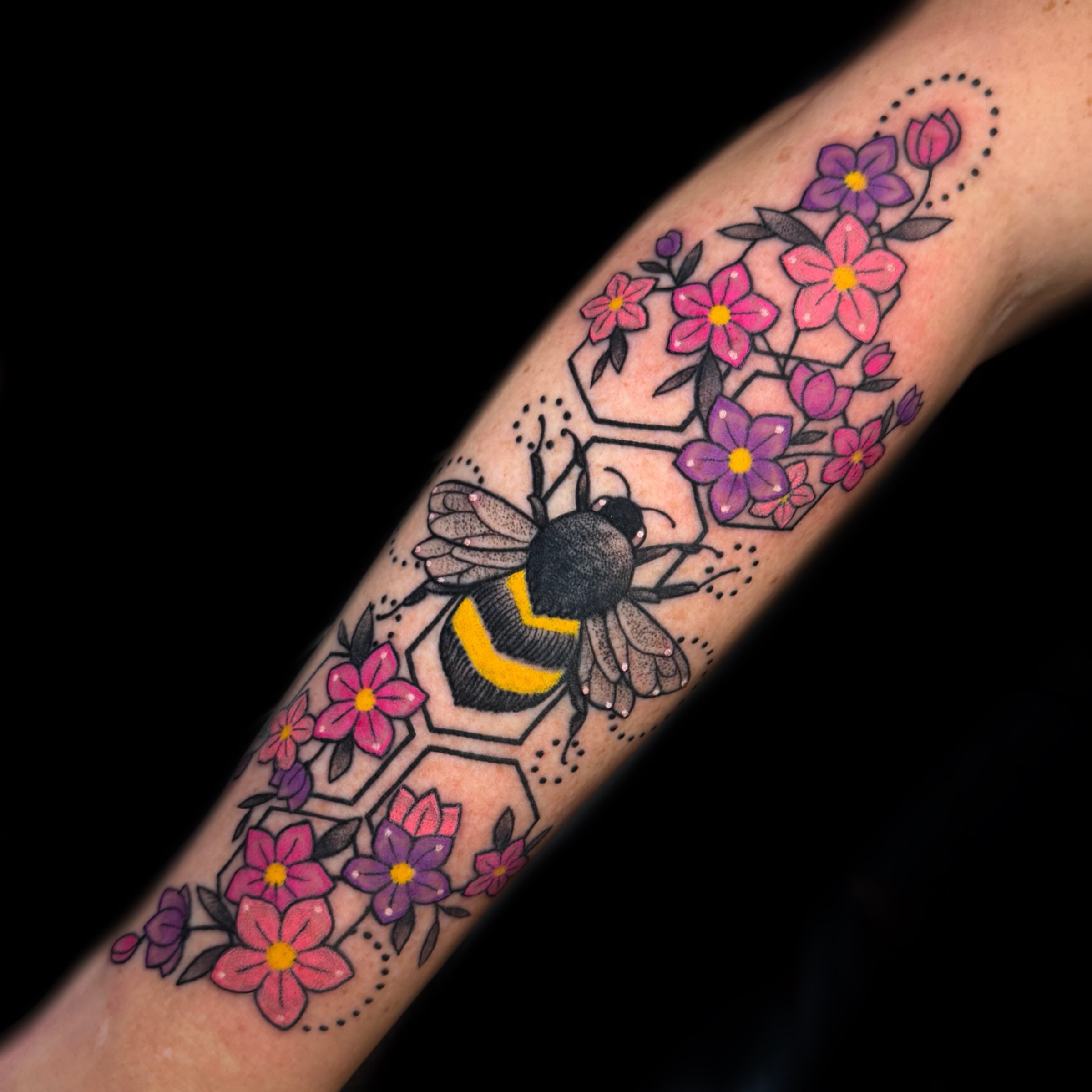 Bumblebee and flowers new school tattoo on the forearm by Kelsea Weir McCree