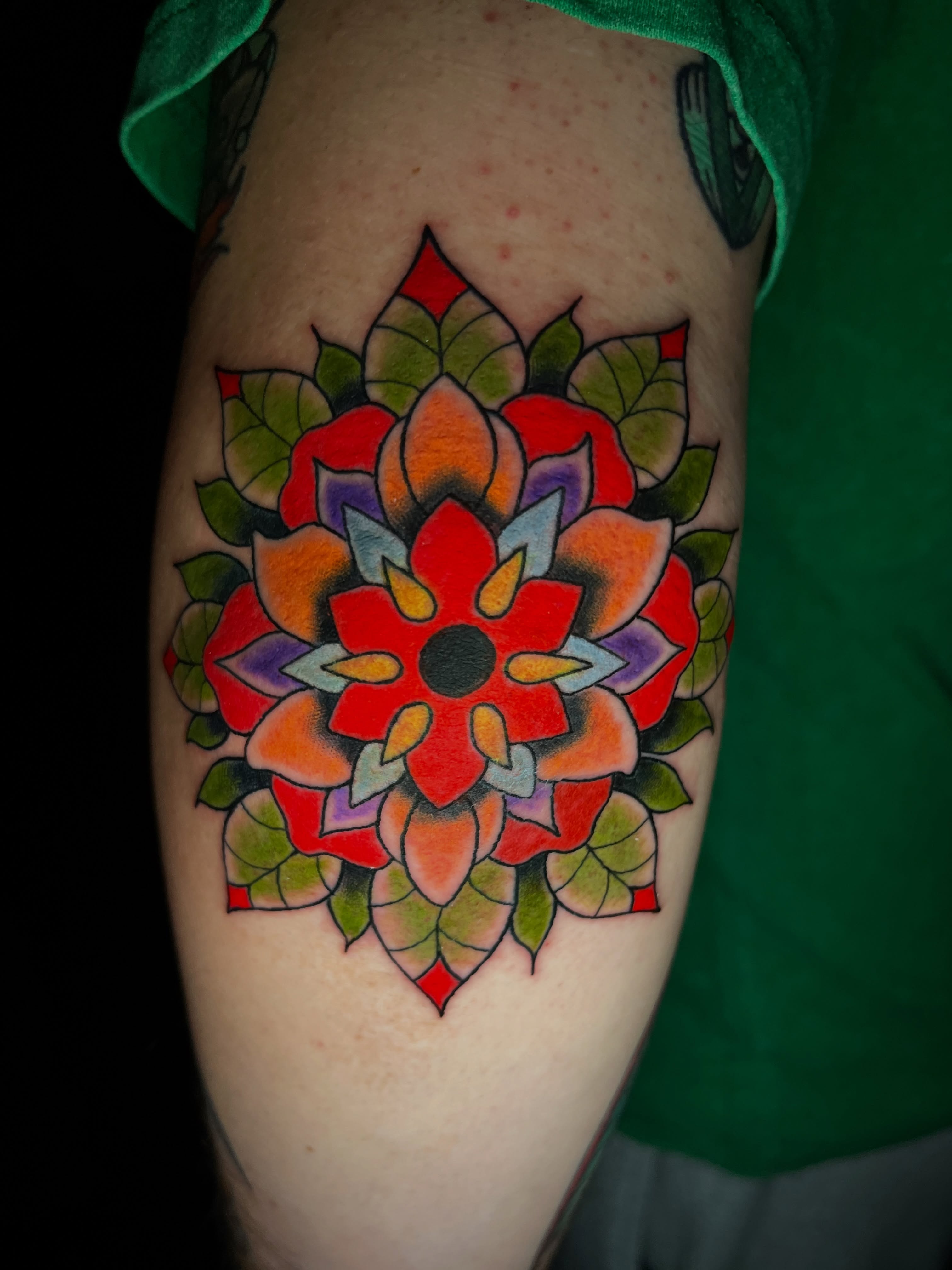 Mandala geometric tattoo on the thigh by Kyle Schneider