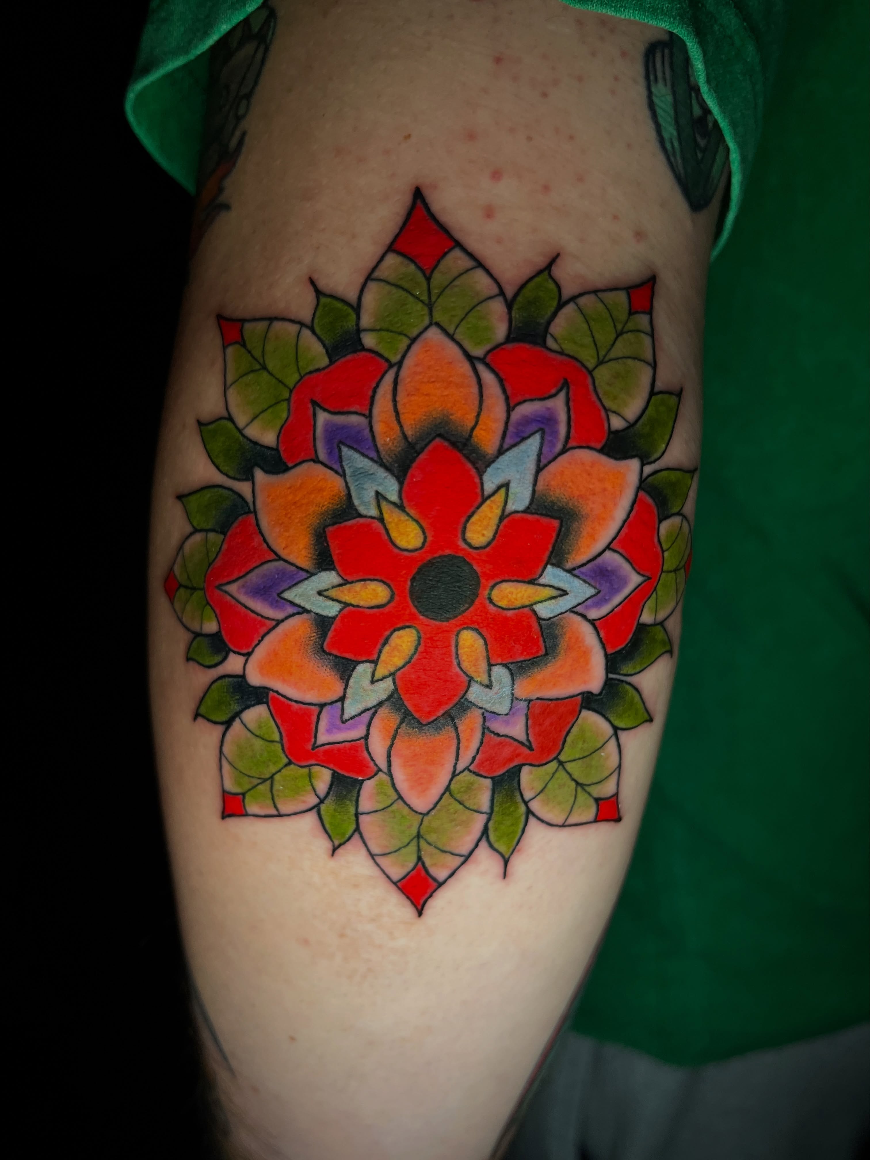 Mandala geometric tattoo on the forearm by Kyle Schneider