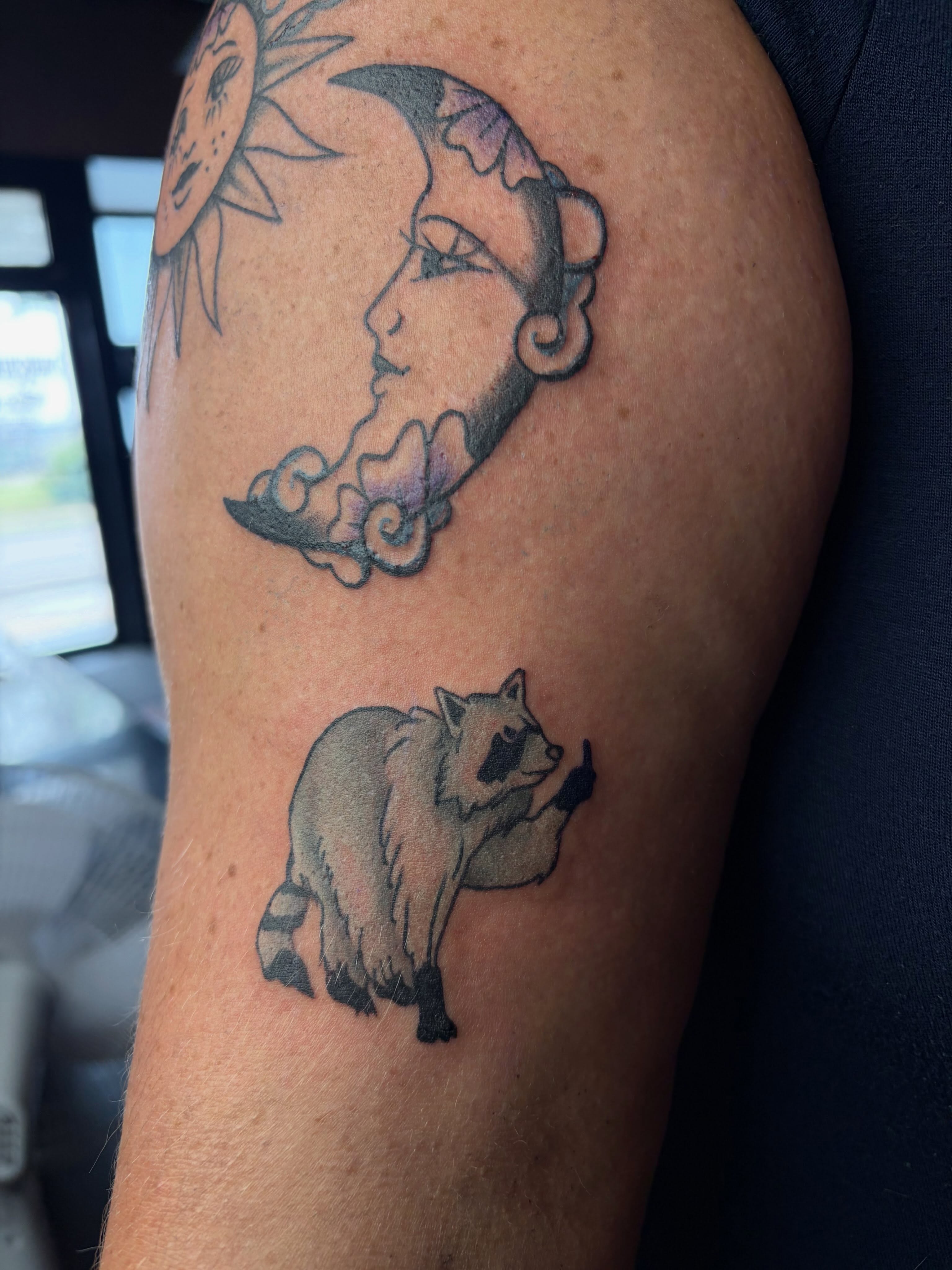 Raccoon and moon black and grey tattoo on the forearm by destany aguilera, Davenport, Iowa