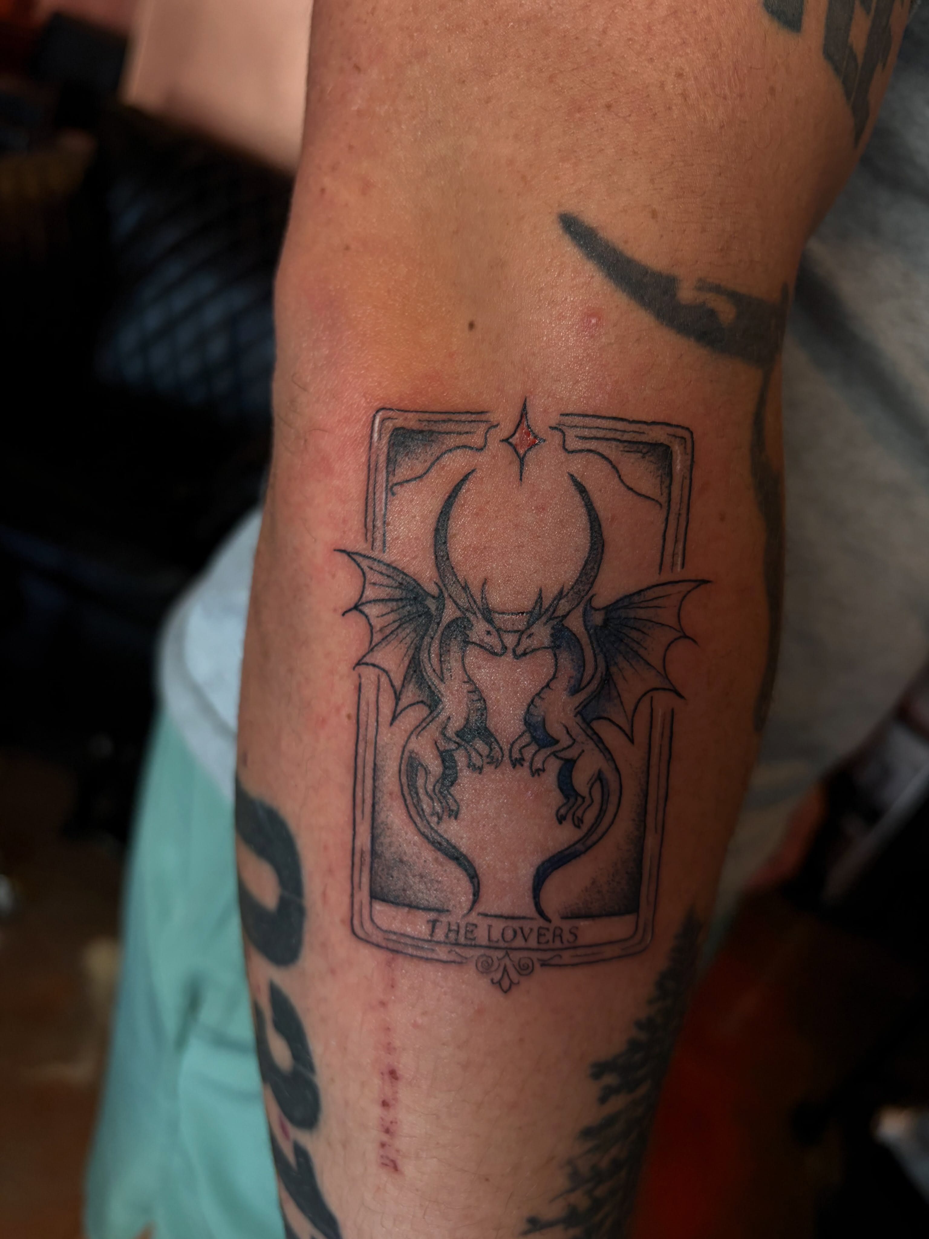 The lovers tarot card black and grey tattoo on the forearm by destany aguilera, Davenport, Iowa