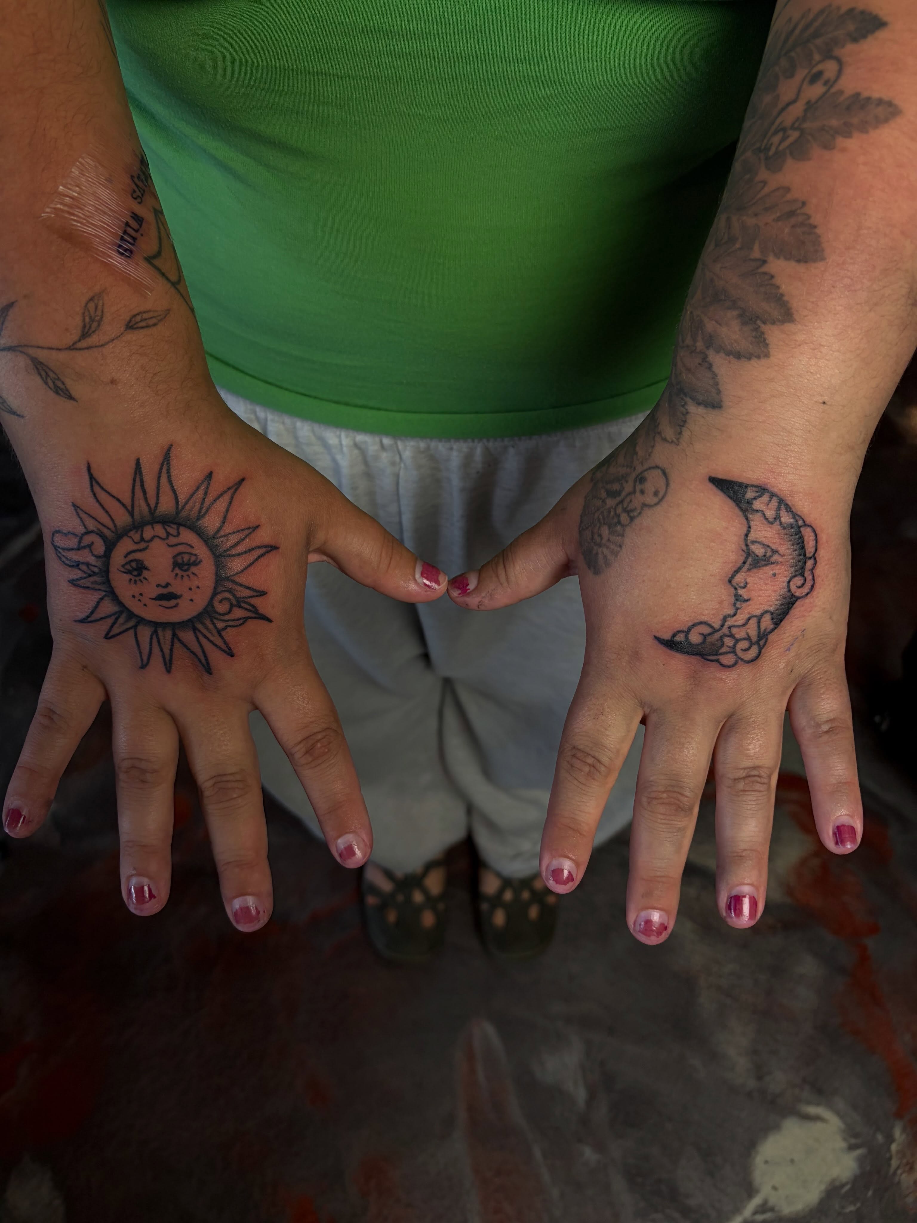 Sun and moon American traditional tattoo on the hand by destany aguilera, Davenport, Iowa
