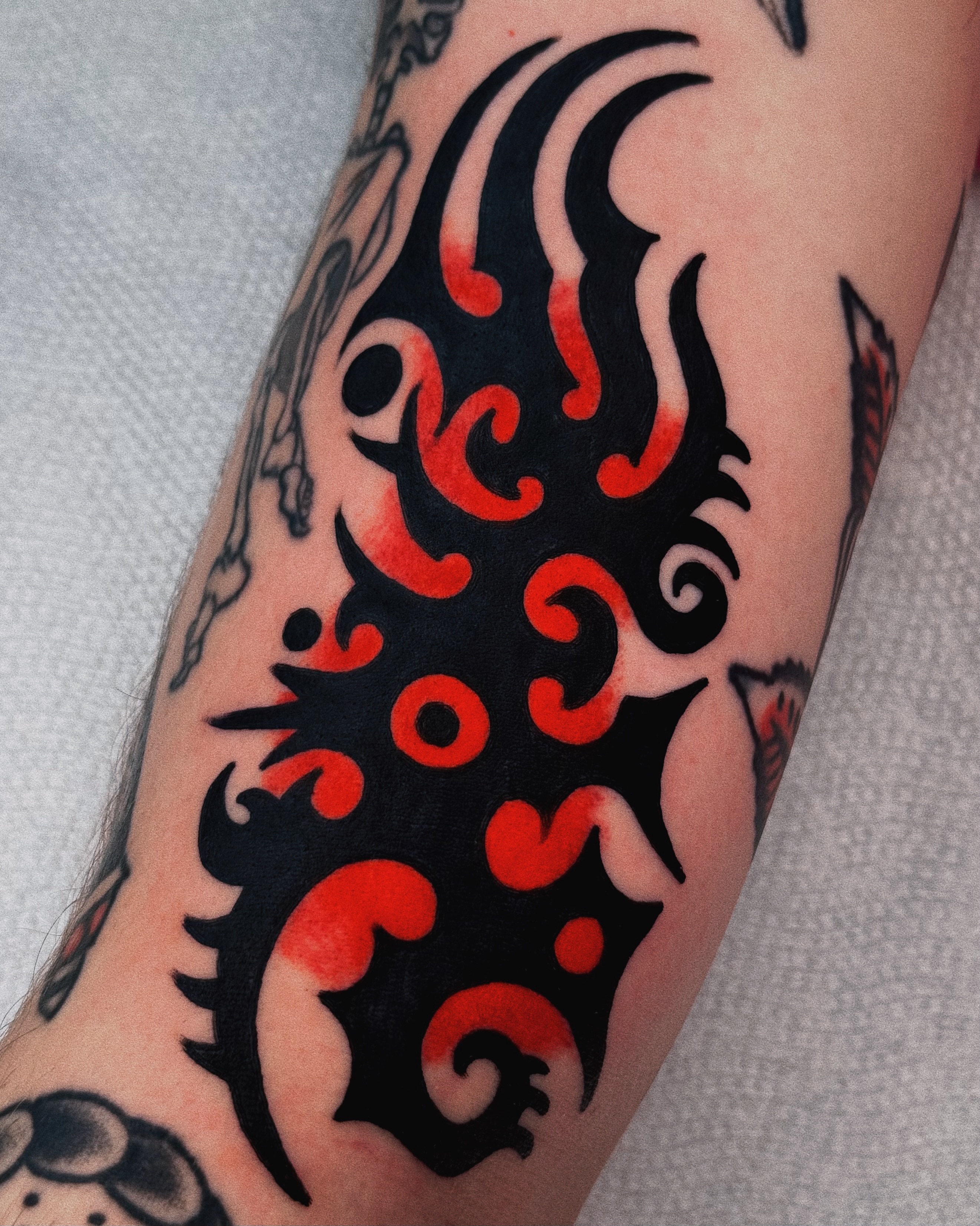 Flame design tribal tattoo on the forearm by Sean Michel, Nashua, New Hampshire