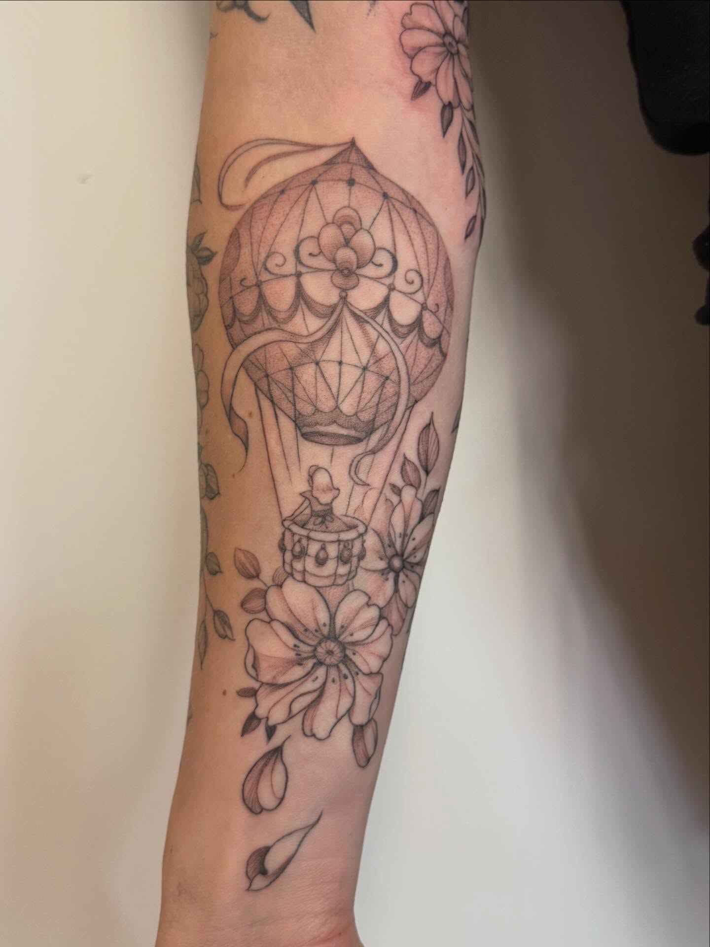 Hot air balloon black and grey tattoo on the forearm by Peter Harren
