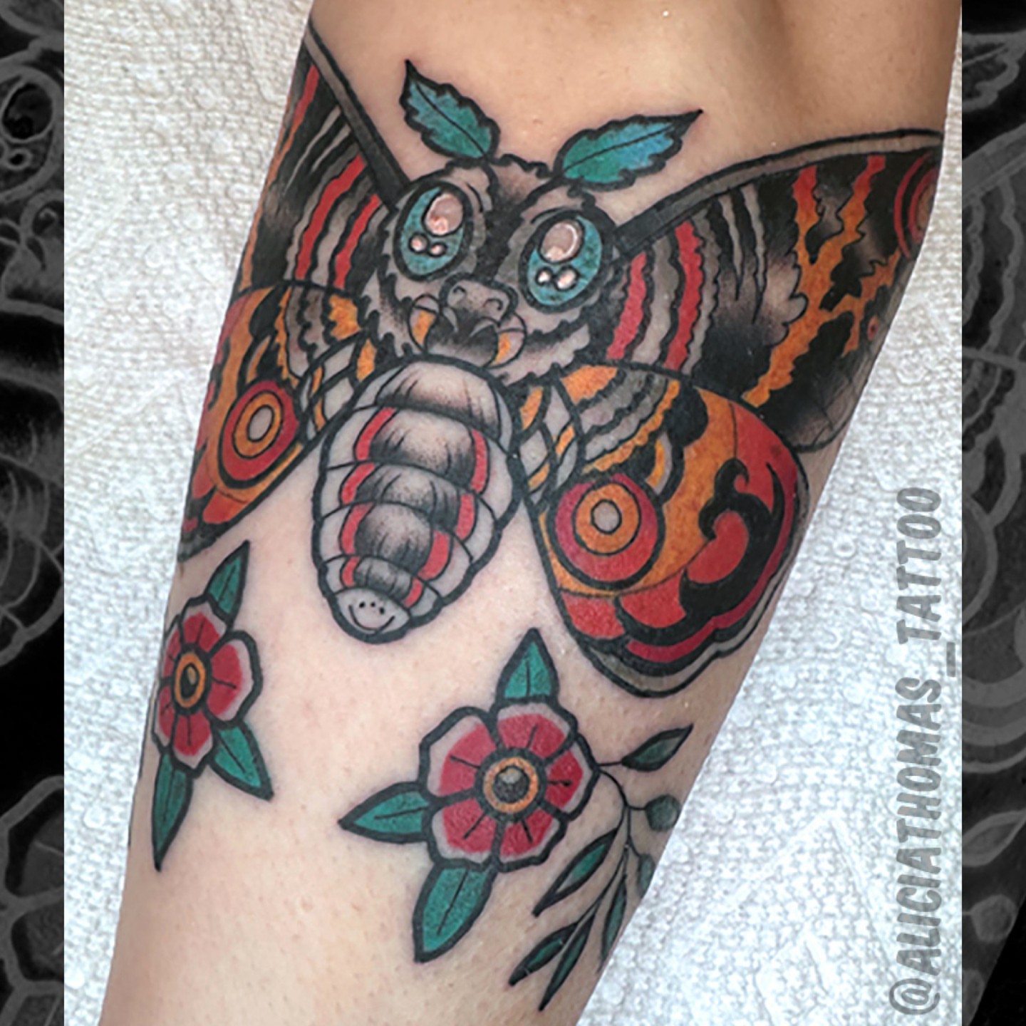 Butterfly and flowers American traditional tattoo on the forearm by 𝖆𝖑𝖎𝖈𝖎𝖆 𝖙𝖍𝖔𝖒𝖆𝖘